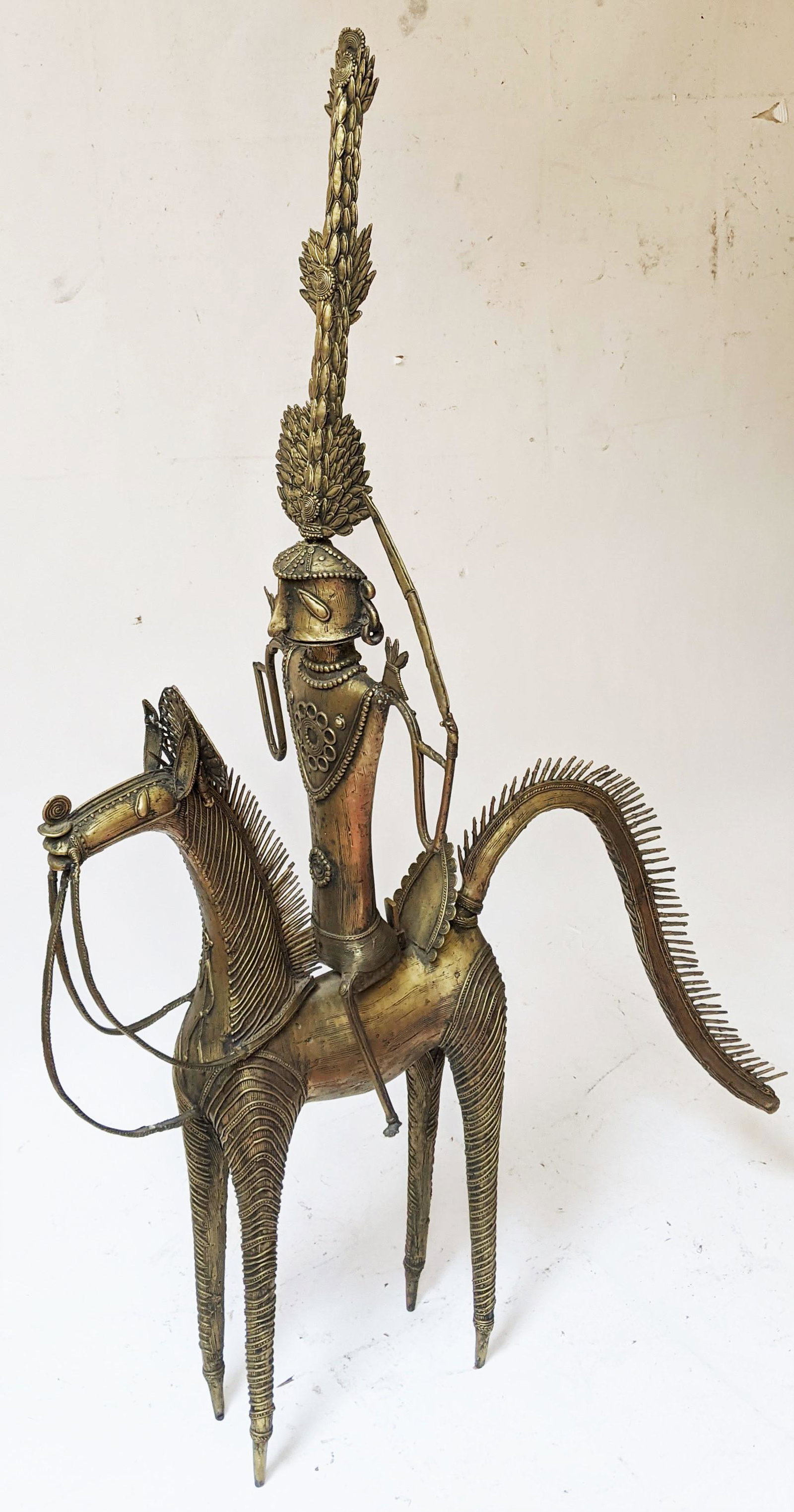 Large Balinese Metal Figure on Horse: Balinese metal figure on horseback, with headdress. [60" H x 40" W]. In good condition.