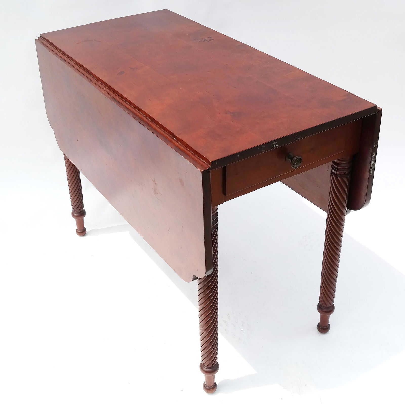 Mahogany Drop Leaf Table: Mahogany drop leaf table, with barley twist legs. [Closed: 29 1/2" H x 19 1/2" W x 38" D; Open: 29 1/2" H x 45 3/4" x 38" D]. In good condition; one mark on top.