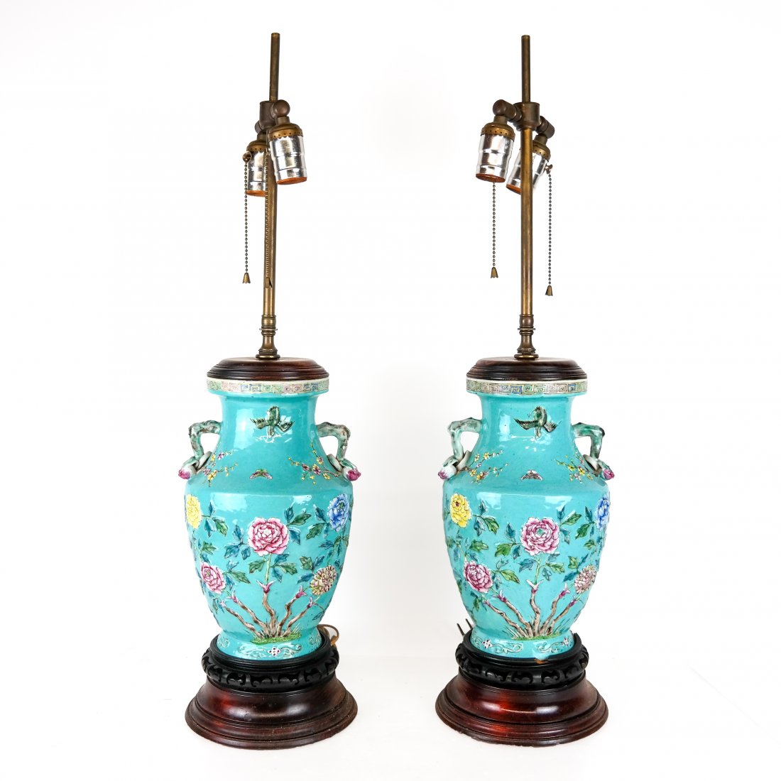Pair of Chinese Relief Decorated Porcelain Lamps: Pair of Chinese relief decorated vases, adapted as lamps, having birds and floral decoration, on hardwood stands mounted to wood bases. Harps with no finials. [Vase: 11 1/2" H; Overall: 28" H x 6 1.2"
