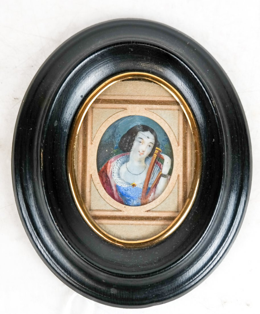 Miniature Framed Painting of Maiden and Harp: Miniature painting of a maiden with a harp, in an oval wood frame. [Art: 1 1/4" H x 1' W; Frame: 4 1/2" H x 3 1/2" W]. In good condition.