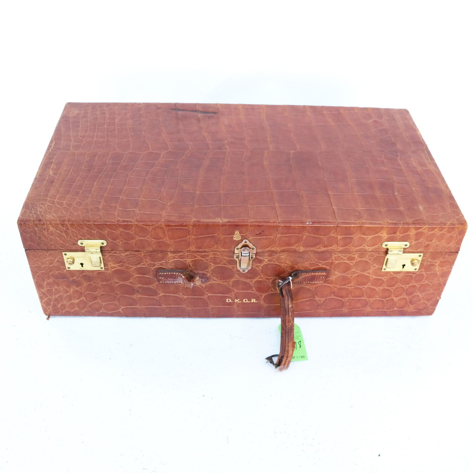 Mark Cross Tan Alligator Suitcase: Large Mark Cross tan alligator hard-sided suitcase, with insert; monogrammed. [9" H x 29" W x 16" D]. Handle worn through; interior soiled.