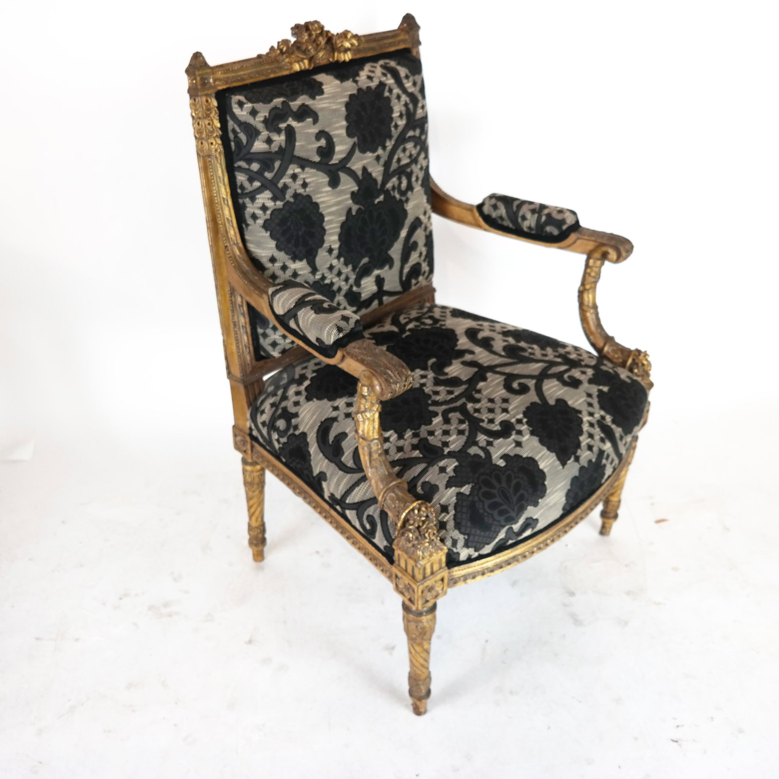 Louis XVI-Style Cornucopia Arm Chair: Louis XVI-style arm chair with carved cornucopia decoration. [37 1/2" H x 25 1/2" W x 22 1/2" D]. Chips; splits; upholstery in good condition.