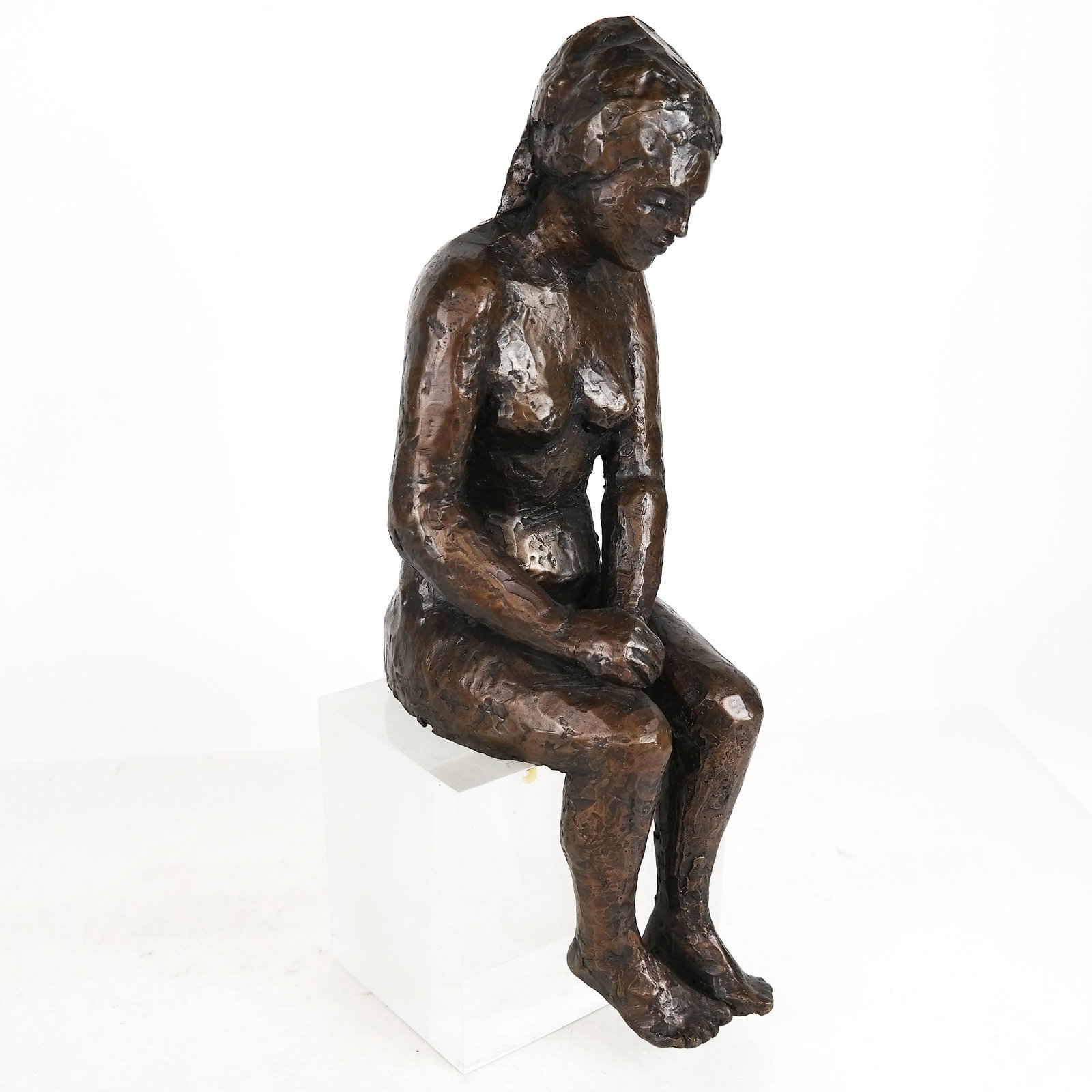 Bronze Seated Nude Sculpture: Bronze seated nude sculpture, on lucite plinth. 16" H x 5 1/2" W x 6 1/2" D].