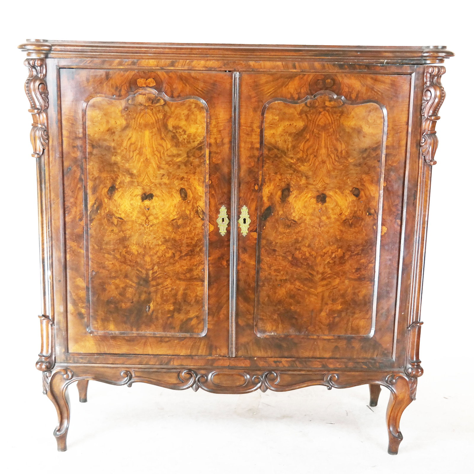 Biedermeier-Style Burlwood Veneer Cabinet: Vintage burlwood veneer cabinet with book-matched veneers. Stamped verso "L. Conr Gruner / Worms". [47" H x 45" W x 19" D].