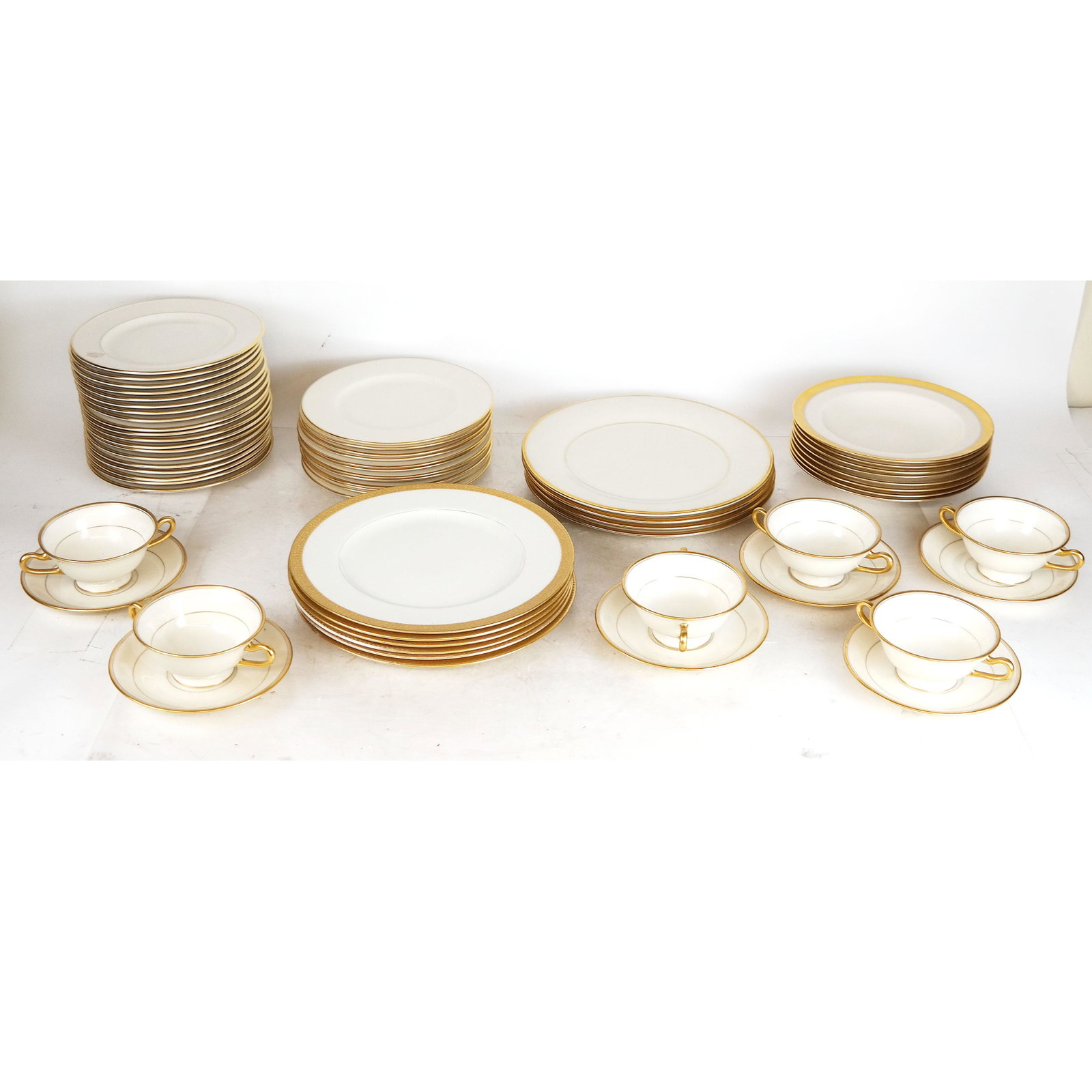 Assorted Lenox Gilt Rim Dinnerware: Plates and cups, together with 18 Lamberton salad plates.