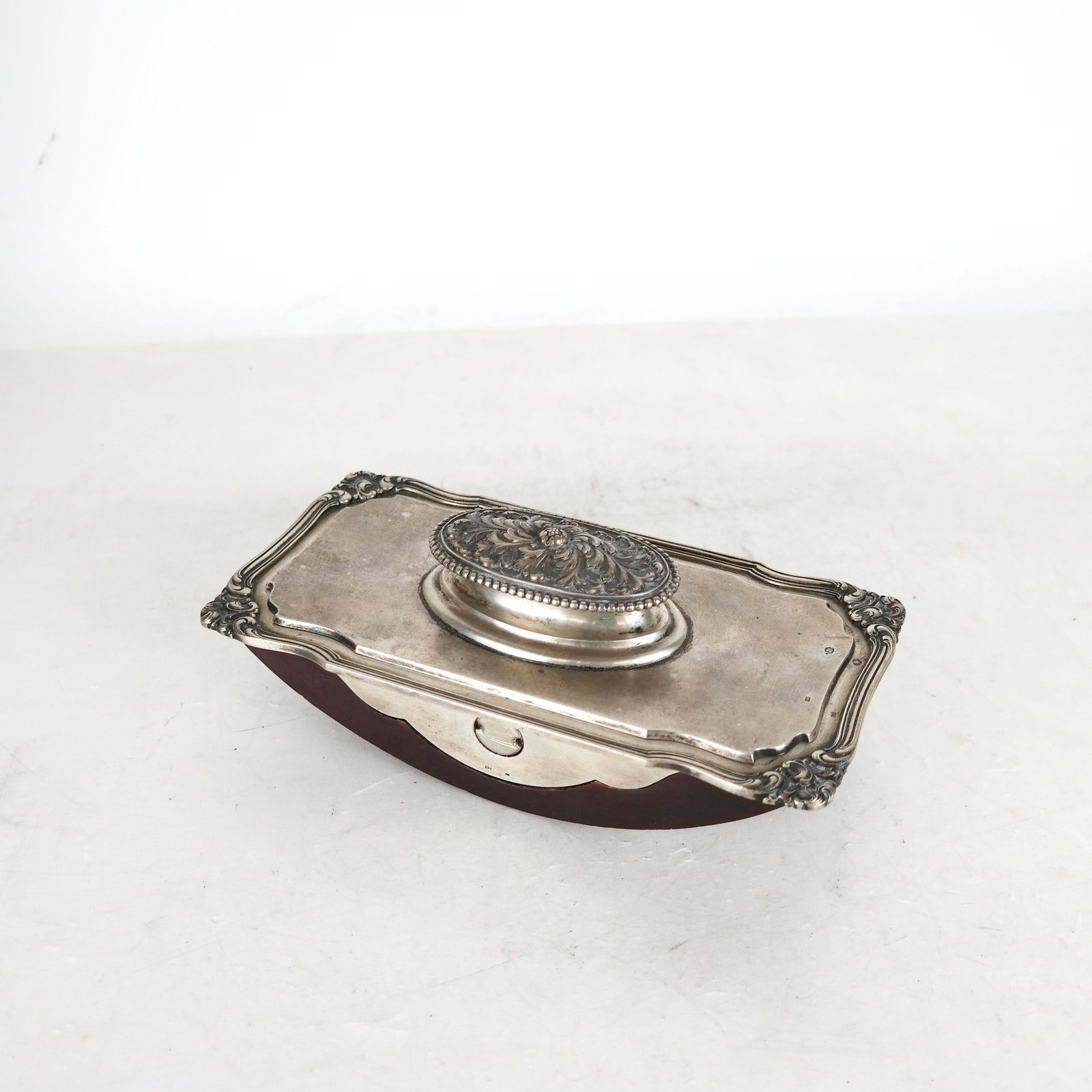 Czech Silver Large Dest Blotter: Desk blotter of silver mount on wood base with handle. [3 1/2" H x 8 1/2" W x 4 1/2" D].