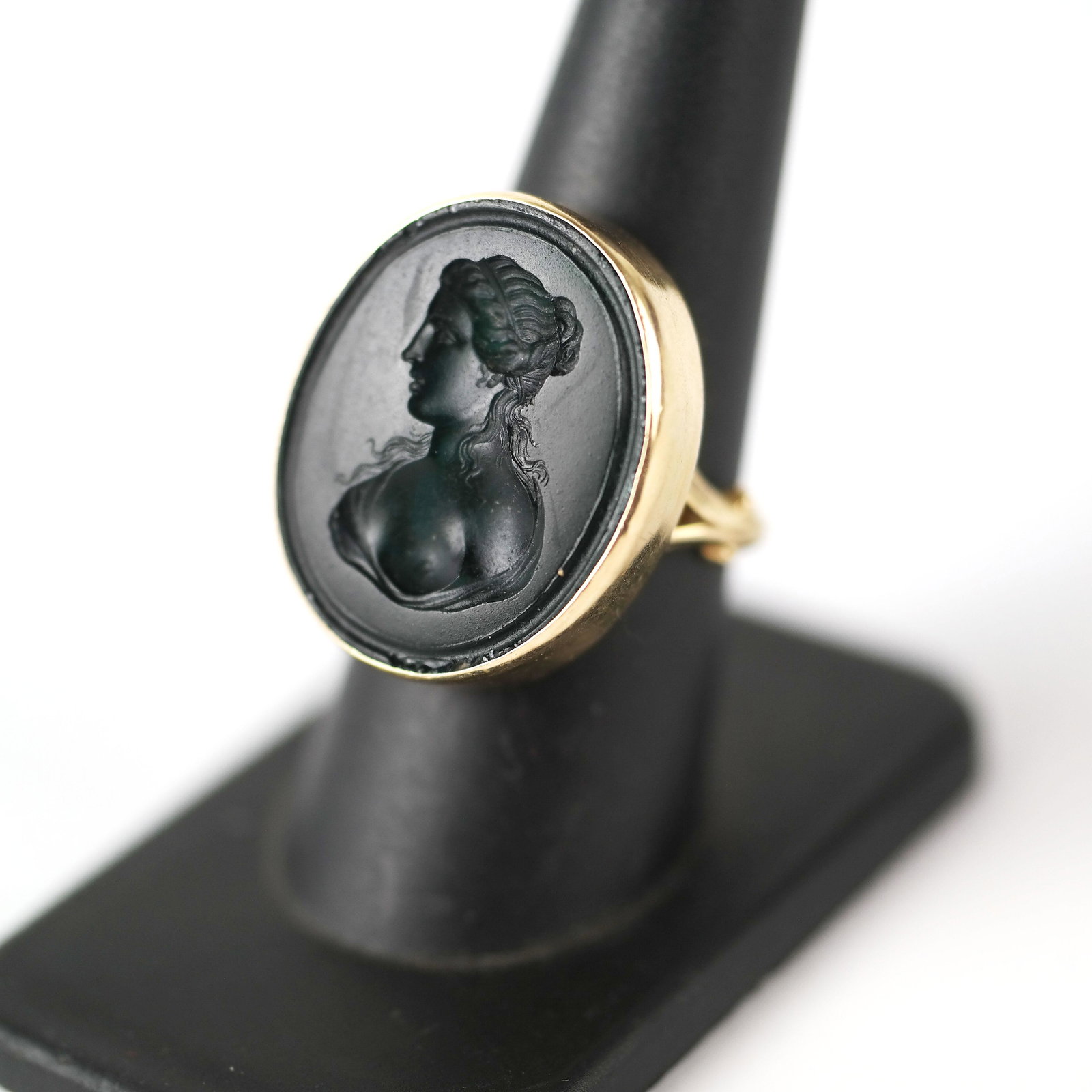 14K Gold & Green Glass Ladies Intaglio ring: 14K yellow gold and green glass intaglio ring, depicting a classical woman. 8.6 dwt. inclusive. Size 8. 20th century, American. In good condition.