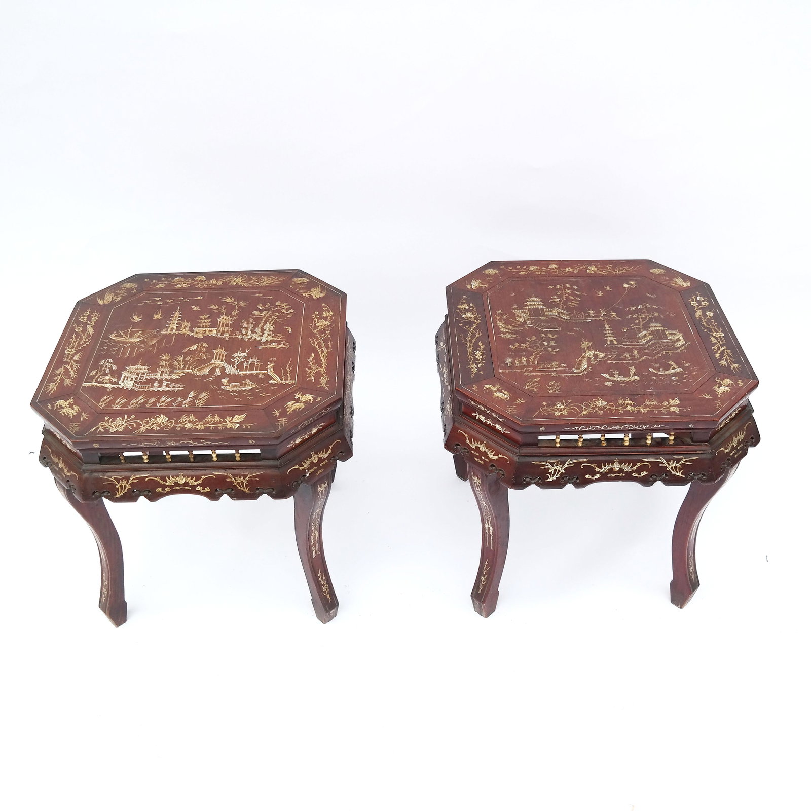 Pair of Chinese Bone Inlaid Hardwood Side Tables: Pair of hardwood tables, late 19th century, inlaid with scenes of pagodas and figures in a landscape. [17 1/2" H x 17" W x 17" D]. Losses and wear; some cracks.
