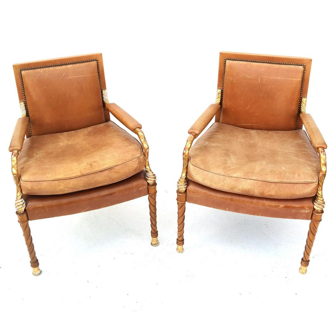 Pair Neoclassic Parcel Gilt Birch Wood Arm Chairs: Pair of 20th century Neoclassic parcel gilt birch wood arm chairs with leather upholstery. [32 3/4 H x 24 1/2" W x 22 1/2" D]. Structurally sound; heavy gold losses