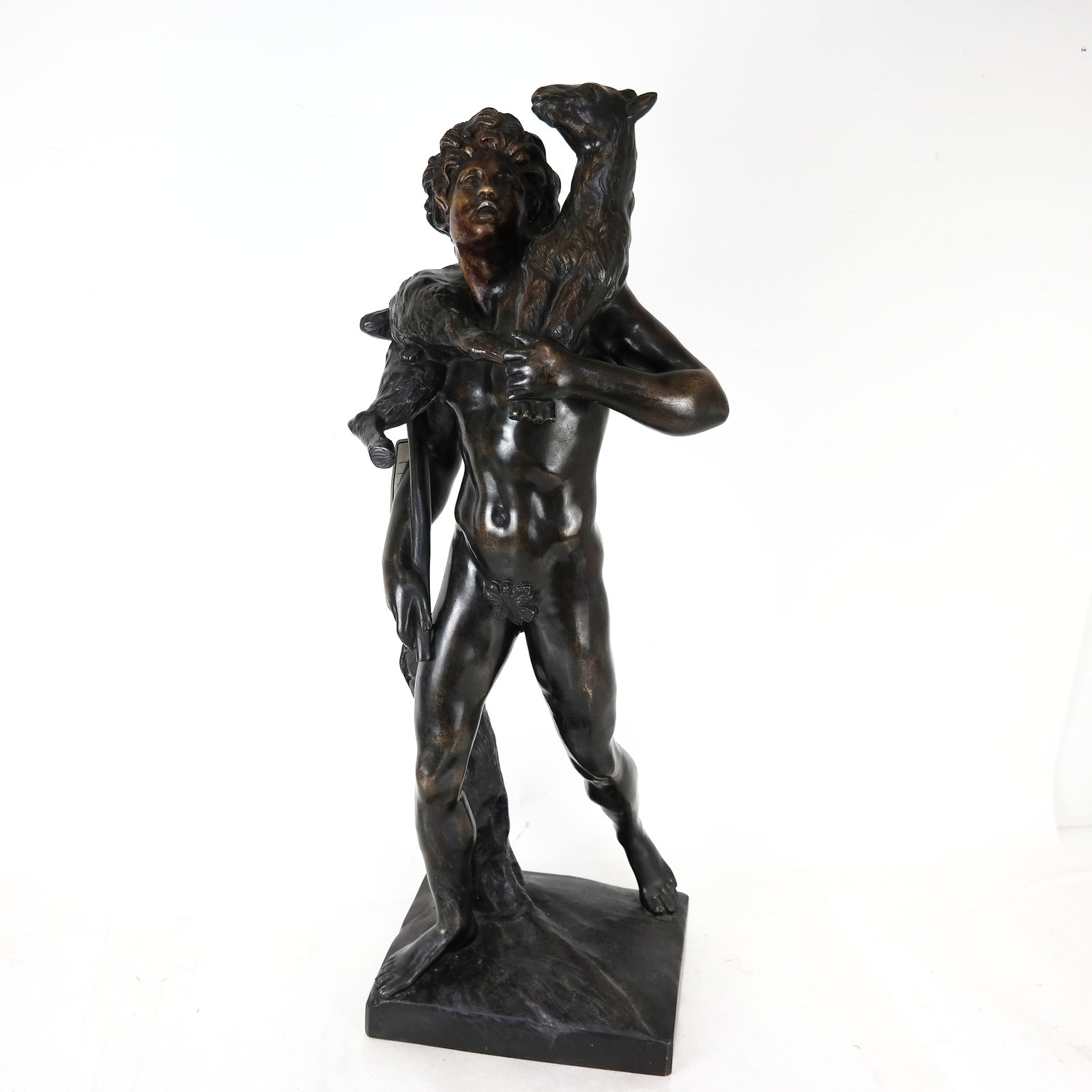 Patinated Bronze Sculpture of a Shepherd: late 19th century patinated bronze sculpture of a shepherd with a lamp, possibly St. John, illegibly signed to base. [28" H x 10" W x 9" D]. Wear and rubbing to patina, especially to face.