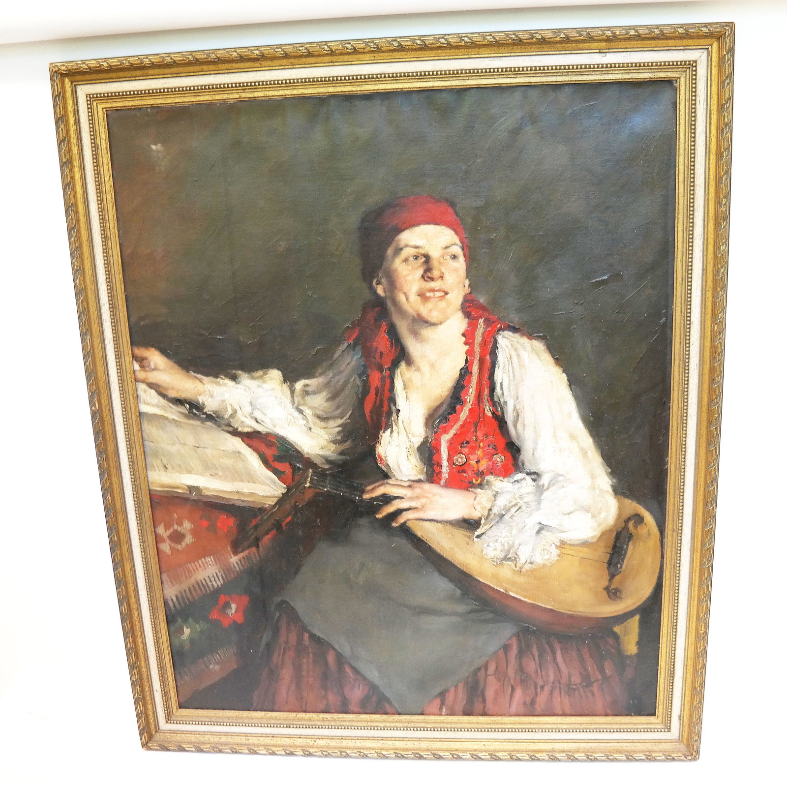 Continental School: Woman w/ Lute - Painting: 19th century Continental School oil on canvas painting of a woman with a lute, seated and dressed in traditional attire; signature not found. [Sight: 38 1/2" H x 31 1/4" W; Frame: 44 1/2" H x 37" W]. 