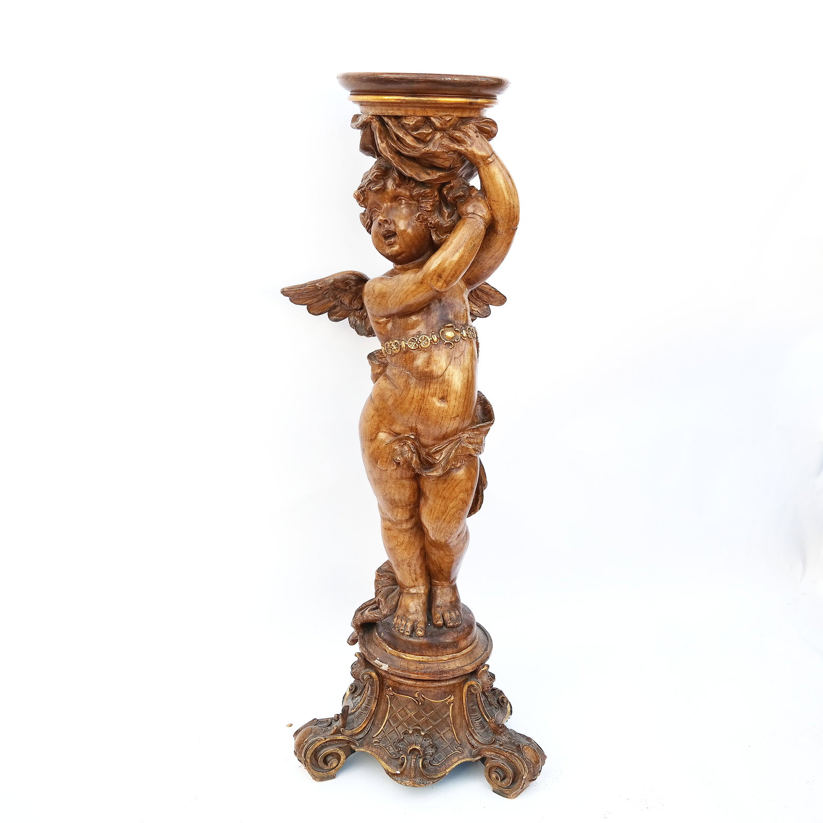Carved Beechwood Cupid Pedestal: 20th century Italian carved beech wood cupid pedestal on a tripod base. [50" H; Base: 18" Diam.]. Minor chips and scratches.