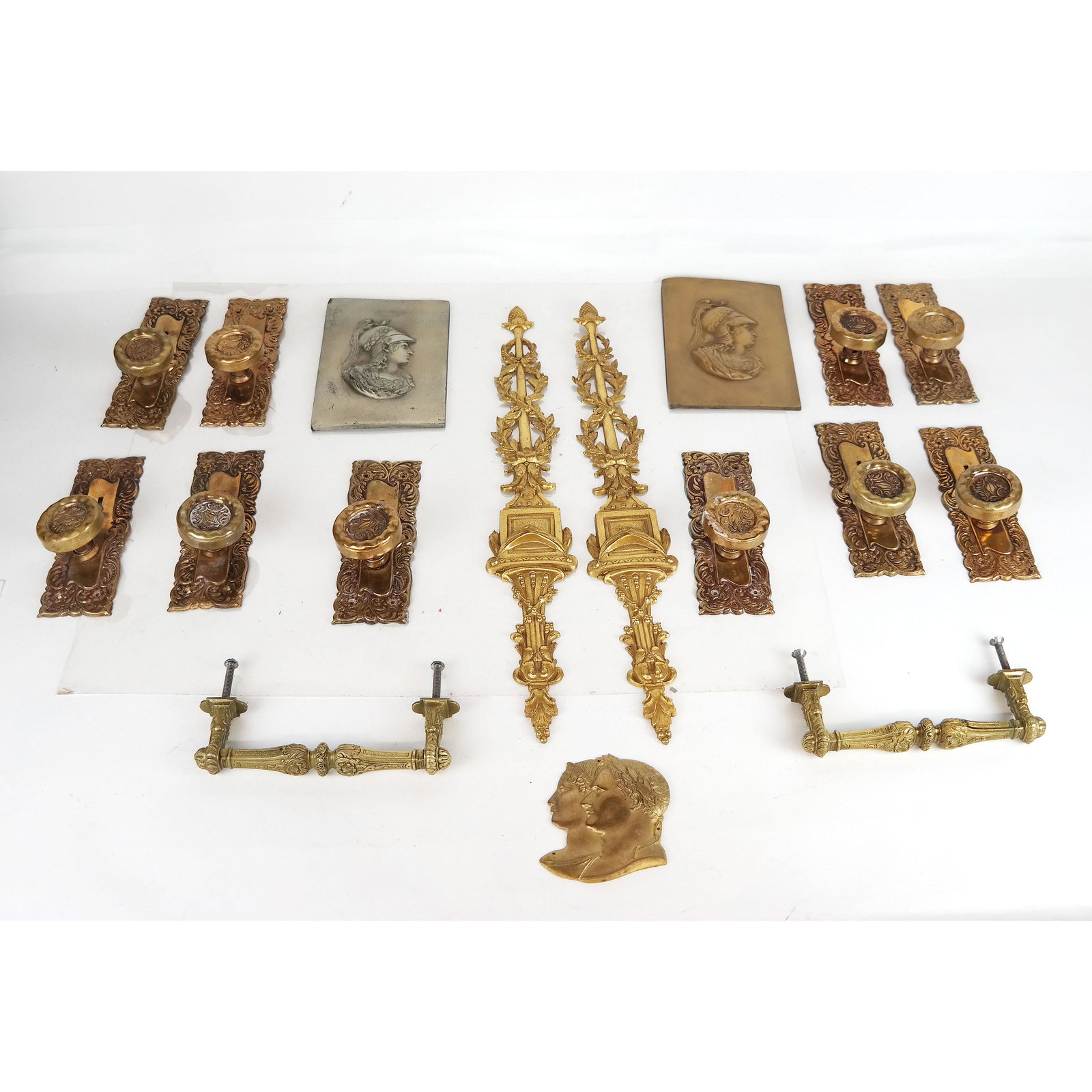 Group of Door Knobs, Appliques & Reliefs: Group of door knobs, appliques and reliefs. 17 pieces total..
