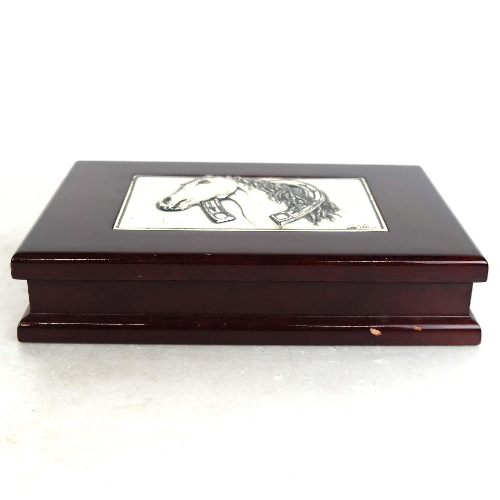 Mahogany Box w/ Horse Head Relief Medallion: Mahogany box with pewter horse's head relief medallion. [2" H x 9 1/2" W x 7" D]. In good condition.