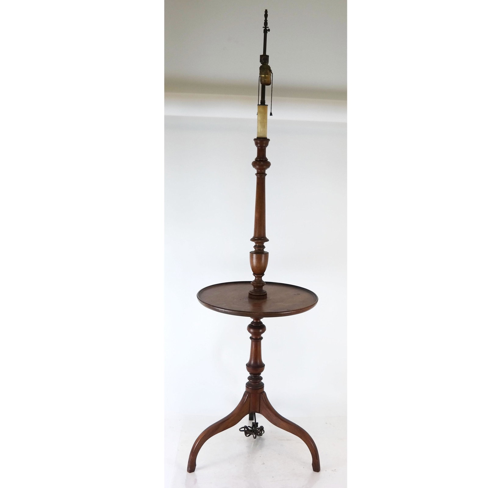 Mahogany Stick Lamp Table: Stick lamp table, having an urn post on lip gallery tray, on three splay leg base. [60" H x 16" Diam.].
