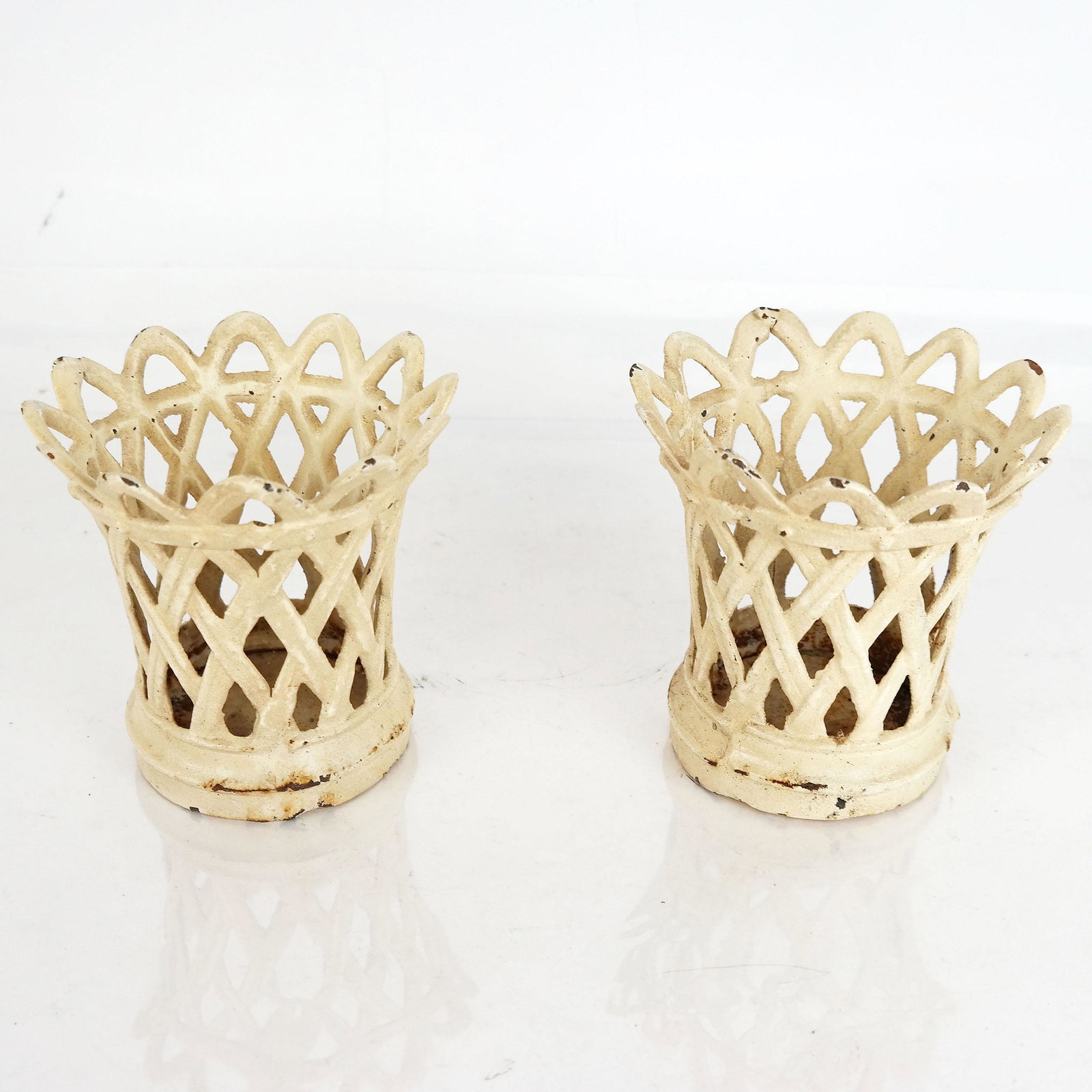 Pair of Painted Iron Basket-Form Containers: Pair of painted iron basket-form containers. Provenance: From the Upper East Side estate of a prominent NYC interior decorator. [5" H x 5" Diam. (top)]. Paint wear; rust.