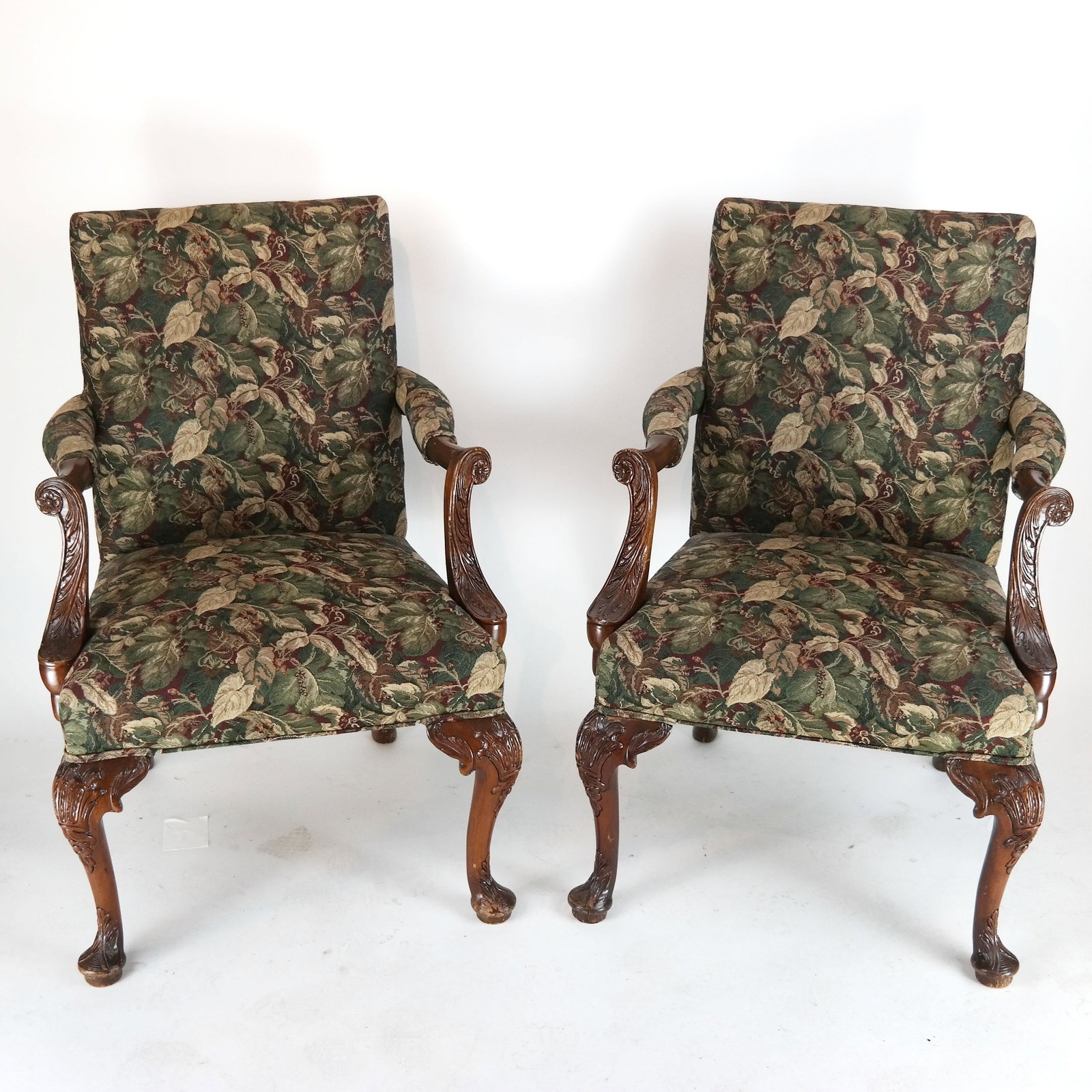 Pair of George I-Style Open Arm Chairs: Pair of George I-style open arm chairs with green floral upholstery. [39" H x 26" W x 27" D].