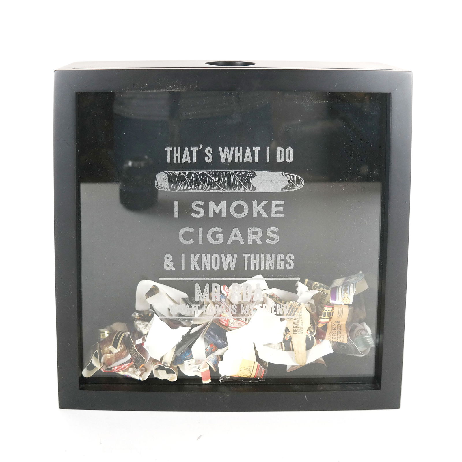 Shadow Box With Cigar Bands: Shadow box for cigar bands with an uncounted number of cigar bands in it. Box customized to read "Mr. RDA / Wyatt Earp Is My Friend". [3 1/2" H x 13" W x 13" D]. In good condition.