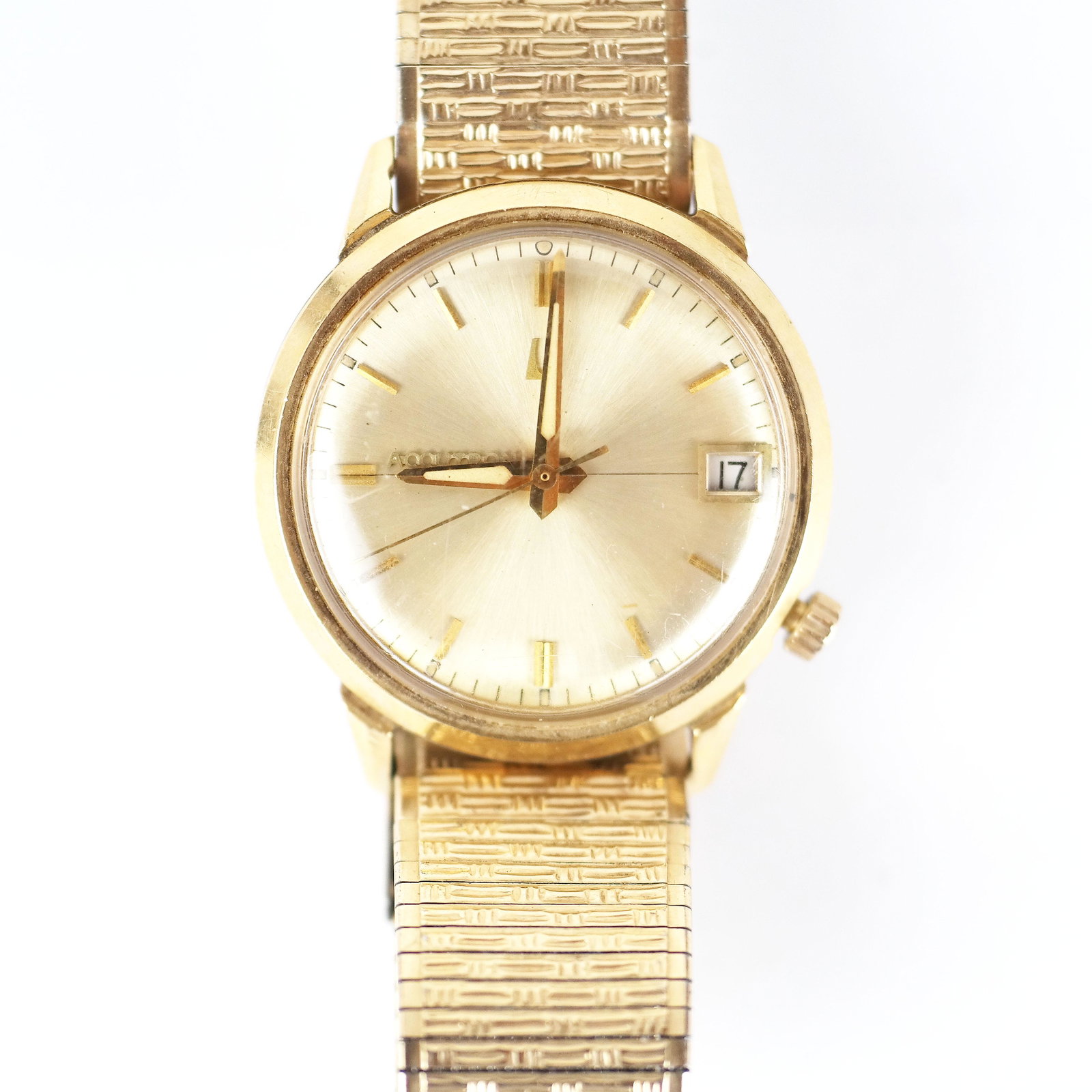 Men's 14K Bulova Accutron Wristwatch: Men's Bulova Accutron watch, having a 14K yellow gold case, M-6 movement, and 10K gold filled and stainless steel band. 39.7 dwt. inclusive. 20th century, American. In good condition.
