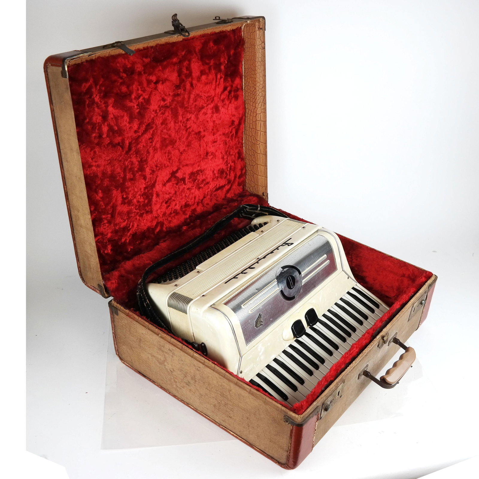 Bernelli Accordion: Bernelli mother-of-pearl accordion, in original case, with new strap included. [Accordion: 6 1/2" H x 16 1/2" W x 14" D; Case: 8" H x 19 1/2" W x 17" D].