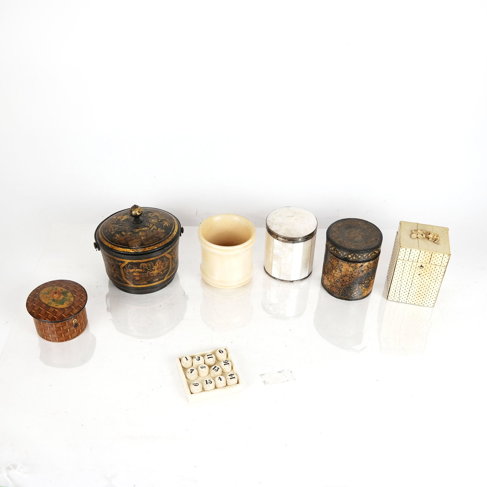 Five Vintage & Antique Boxes & Others: Lot of decorated boxes, of bone, papier mache, lacquer and mother-of-pearl, plus a ceramic vessel and a small ceramic plate with numbered cubes. Provenance: From the Upper East Side estate of a promin
