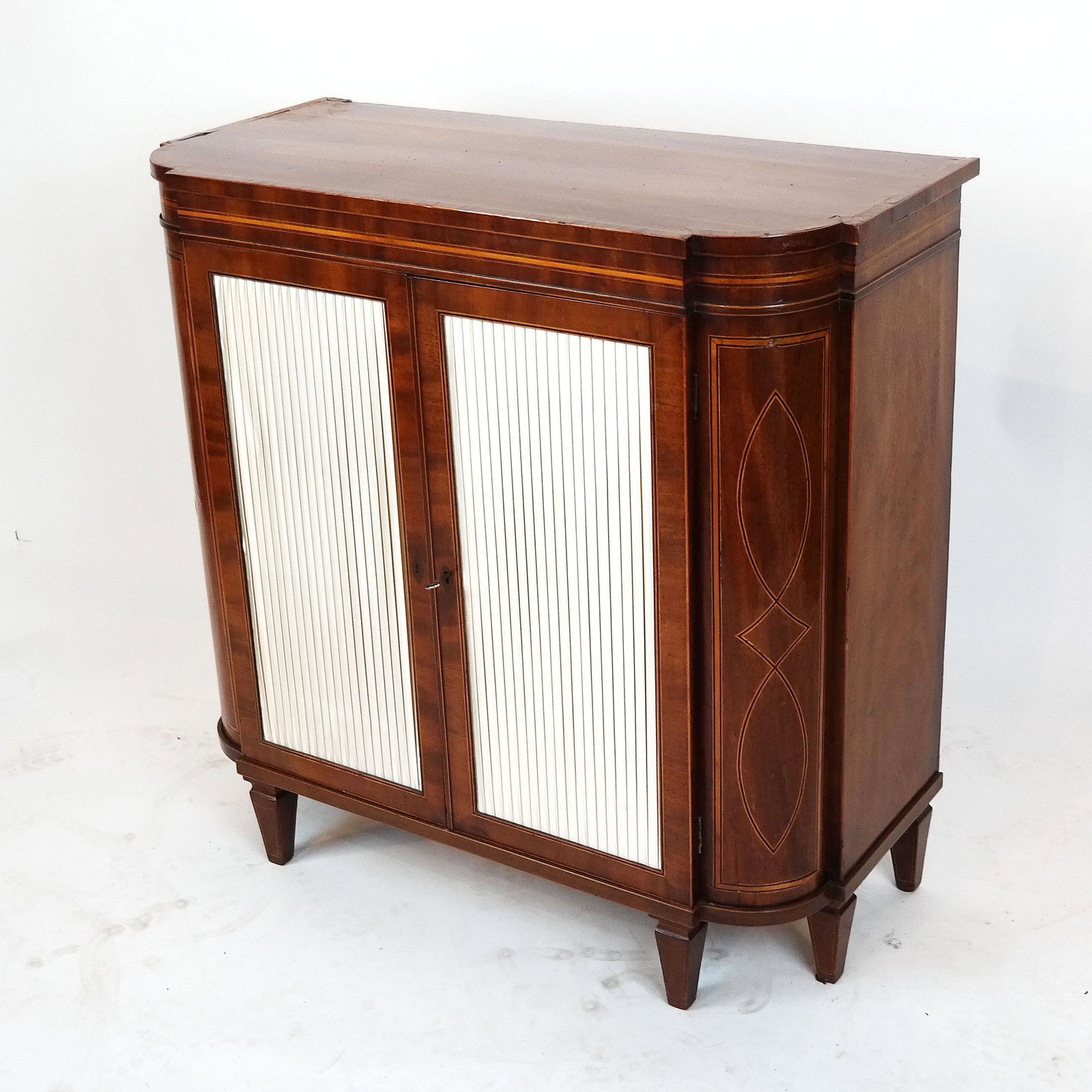 George III Mahogany & Inlaid Pier Cabinet: Late 18th century George III mahogany and line-inlaid pier cabinet. Provenance: Christie's, London "Interiors" sale, December 14, 2016, lot 434. [33 3/4" H x 34 1/8" W x 15 5/8" D]. In good condition.