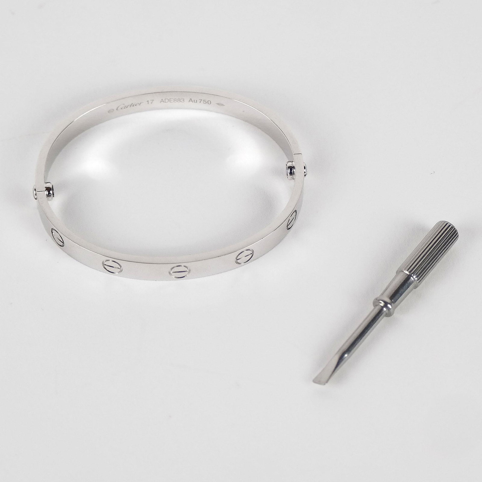 Cartier "Love" Bracelet: Cartier 18K white gold "Love" bracelet, size 17, stamped "ADE883, AU750". Minor wear.