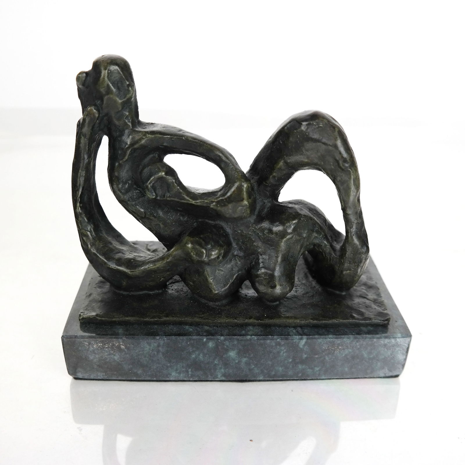 After Jacques LIPCHITZ: "Etude..." - Sculpture: After Jacques Lipchitz (French, 1891-1973), bronze sculpture of a reclining nude, titled "Etude Pour Hagar", on a green marble base, signed on rear of sculpture. [6 1/2" H x 7 1/4" W x 4" D].