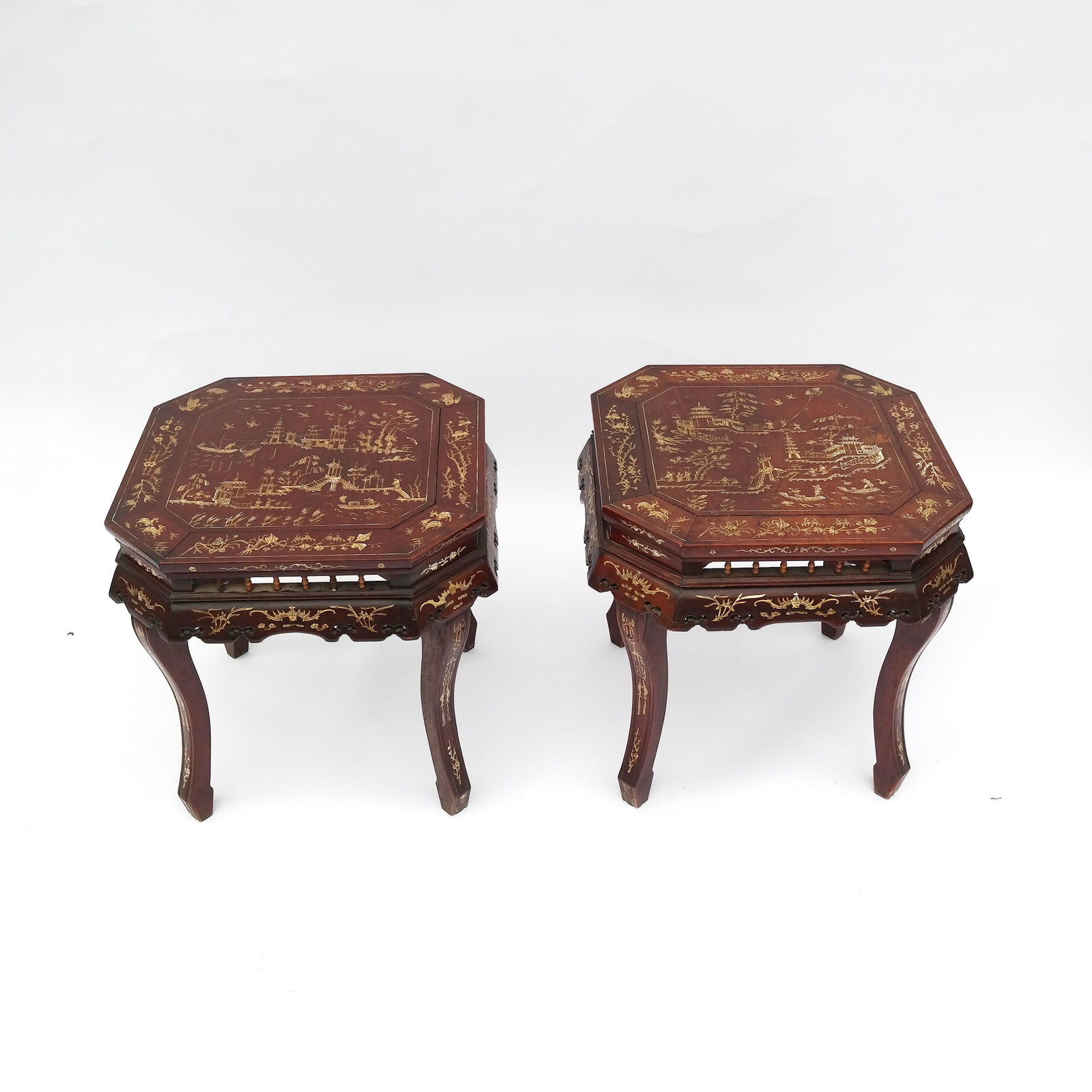 Pair of Chinese Bone Inlaid Hardwood Side Tables: Pair of hardwood tables, late 19th century, inlaid with scenes of pagodas and figures in a landscape. [17 1/2" H x 17" W x 17" D]. Losses and wear; some cracks.