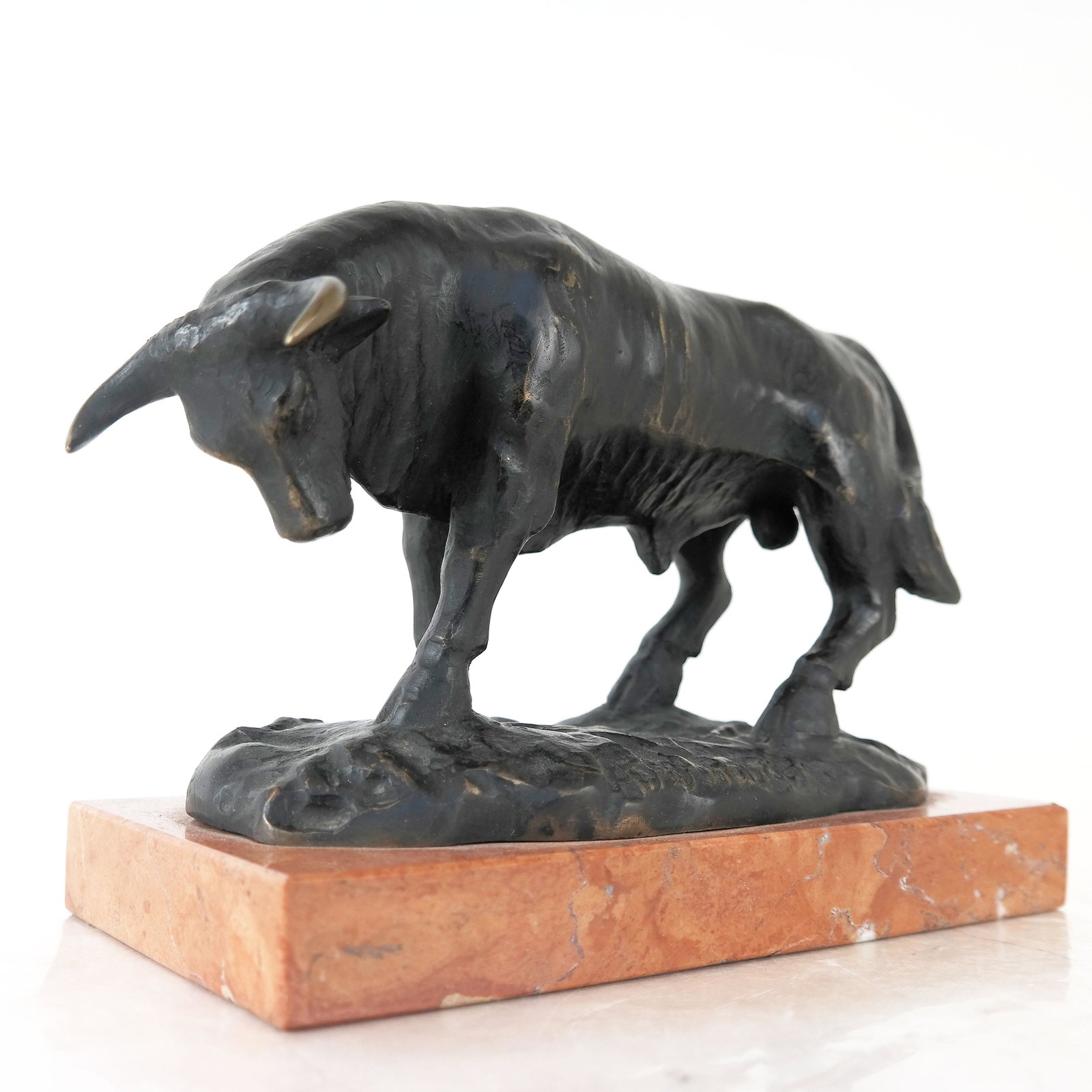 A. FERNANDEZ: Bronze Sculpture of Bull: Bronze sculpture of a bull, raised on marble base, signed to base. [7" H x 11" W x 4 3/4" D]. Wear and rubbing to patination; wear and chips to marble base.
