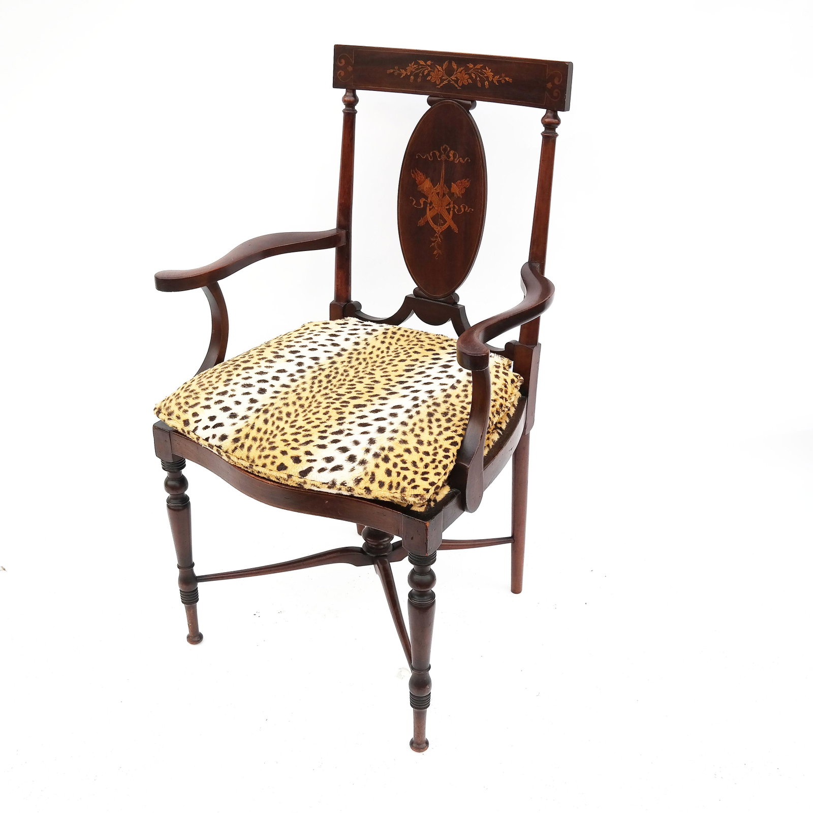 19th C. American Mahogany Arm Chair: 19th century American mahogany arm chair, with faux leopard cushion and seat cover. [35 1/2" H x 19" W x 19" D]. In good condition.