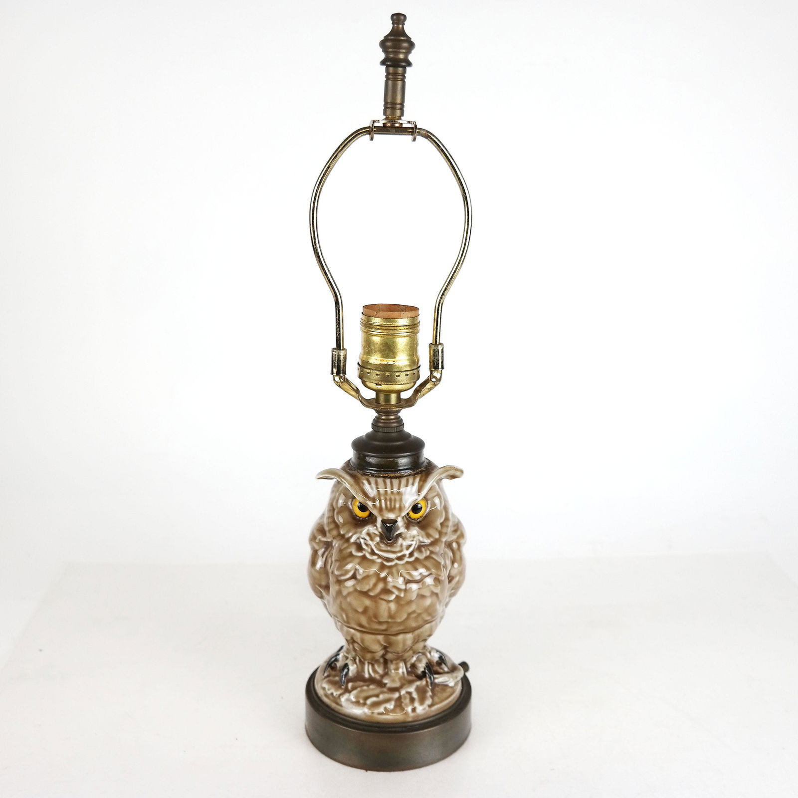 Glazed Porcelain Owl Form Lamp: Glazed porcelain owl form lamp with glass eyes. [16" H].