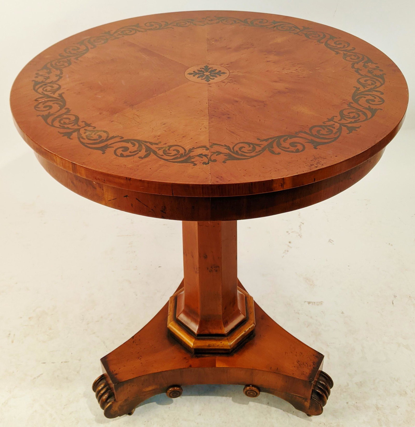 English Burl Circular Table: English inlaid round burl table on an octagonal pedestal base. [28" H x 23 3/4" Diam.]. In good condition.
