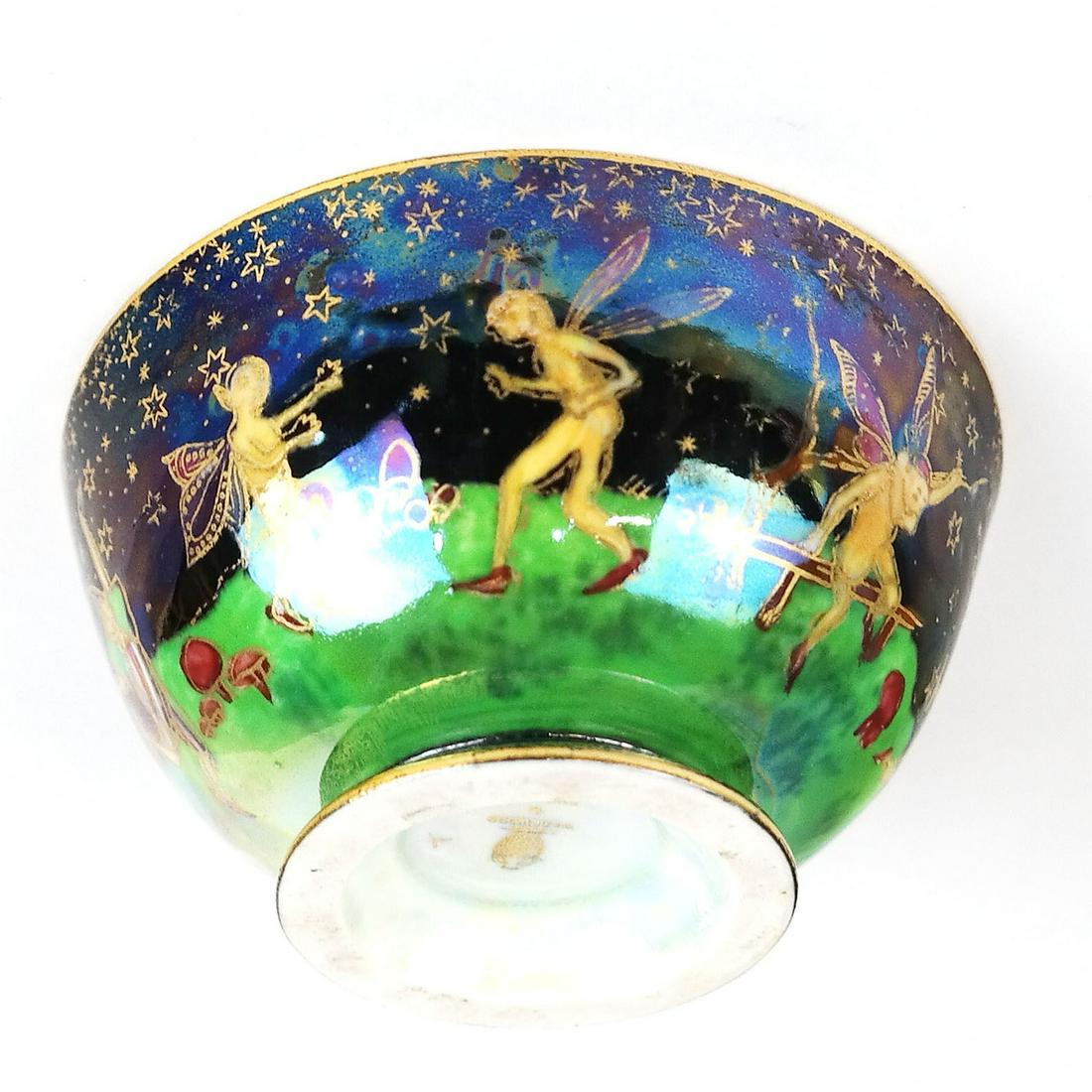 Wedgwood Fairyland Luster Fairies Bowl: Art Nouveau Wedgwood porcelain luster bowl by Daisy Makeig Jones, circa 1920, the outside depicting imps and fairies cavorting against a starry sky, the inside light blue with two imps, fairies, and f