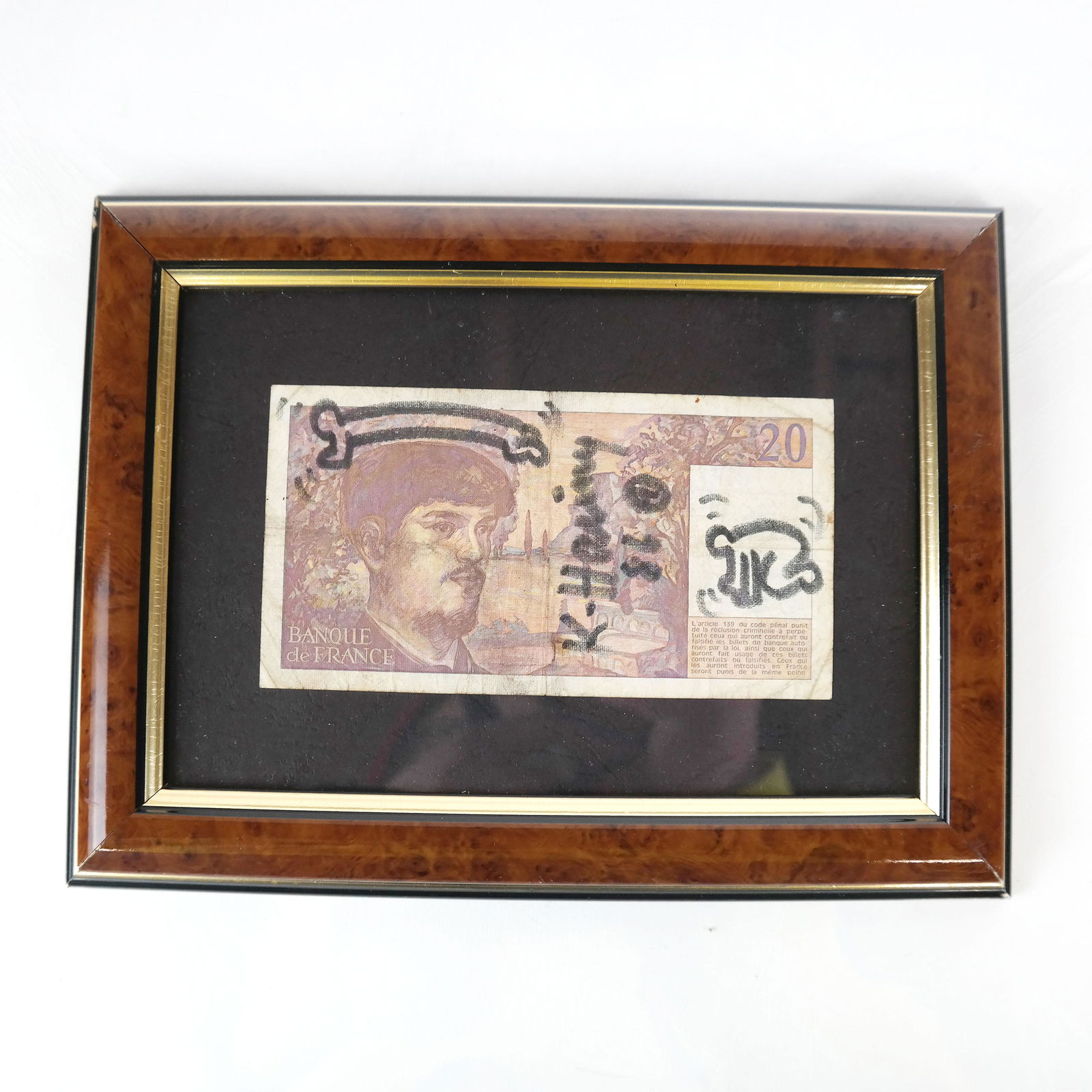 Keith HARING: Drawing on 20-Franc Note: Keith Haring humorous erotic drawing on a 20-franc note. [Frame: 7" H x 9 1/4" W]. In good condition.