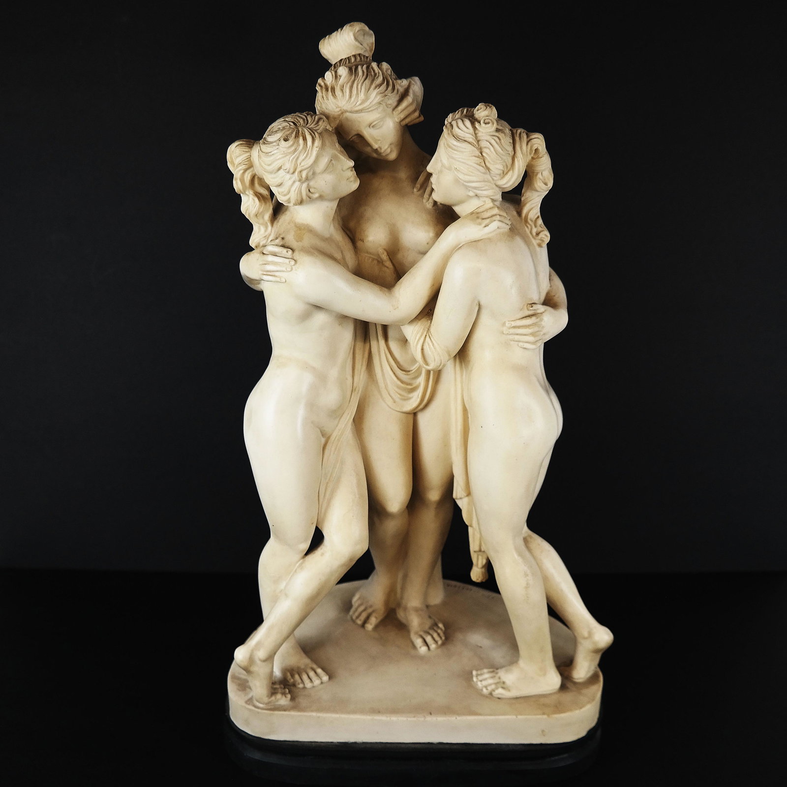 Composition Group: Three Graces: Three Neoclassical nude females on stand, signed A. Santini. [17 1/2" H x 9 1/2" W x 7" D].