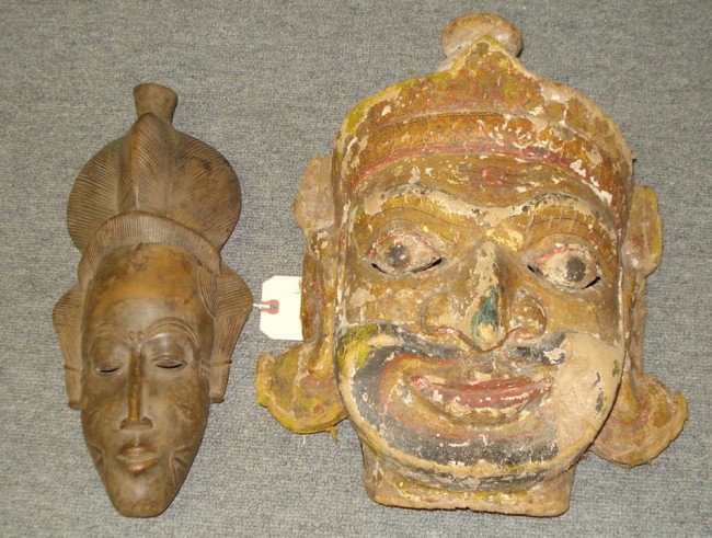 Two African Masks: Ivory Cost Dancing Mask and another mask made of wood and coconut.
