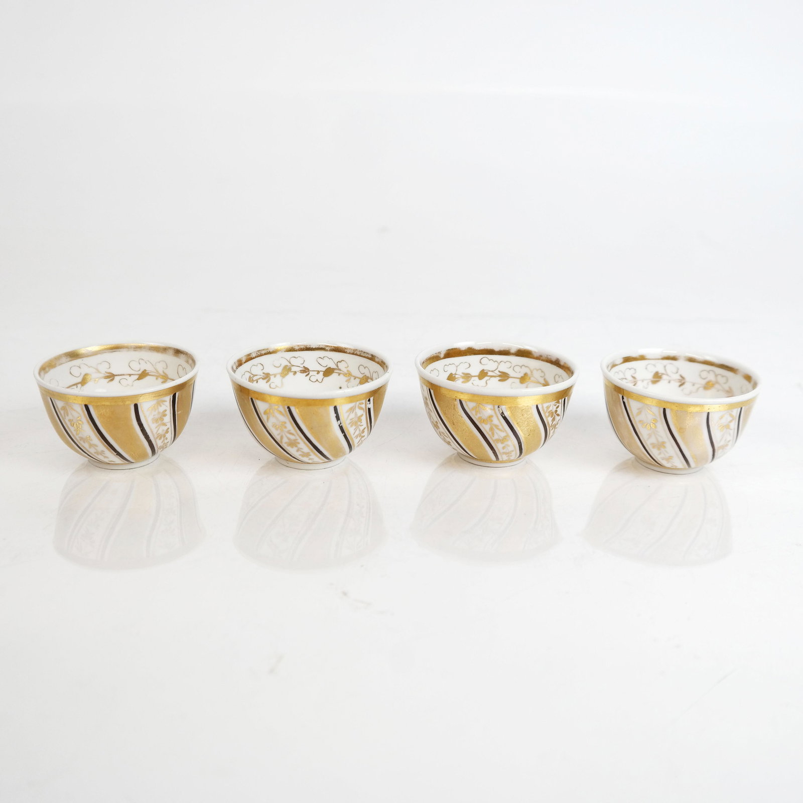 Four Meissen Gilt Porcelain Small Bowls: Four Meissen gilt porcelain small bowls. [1 1/2" H x 2 3/8" Diam.]. No cracks or chips; gilt wear.