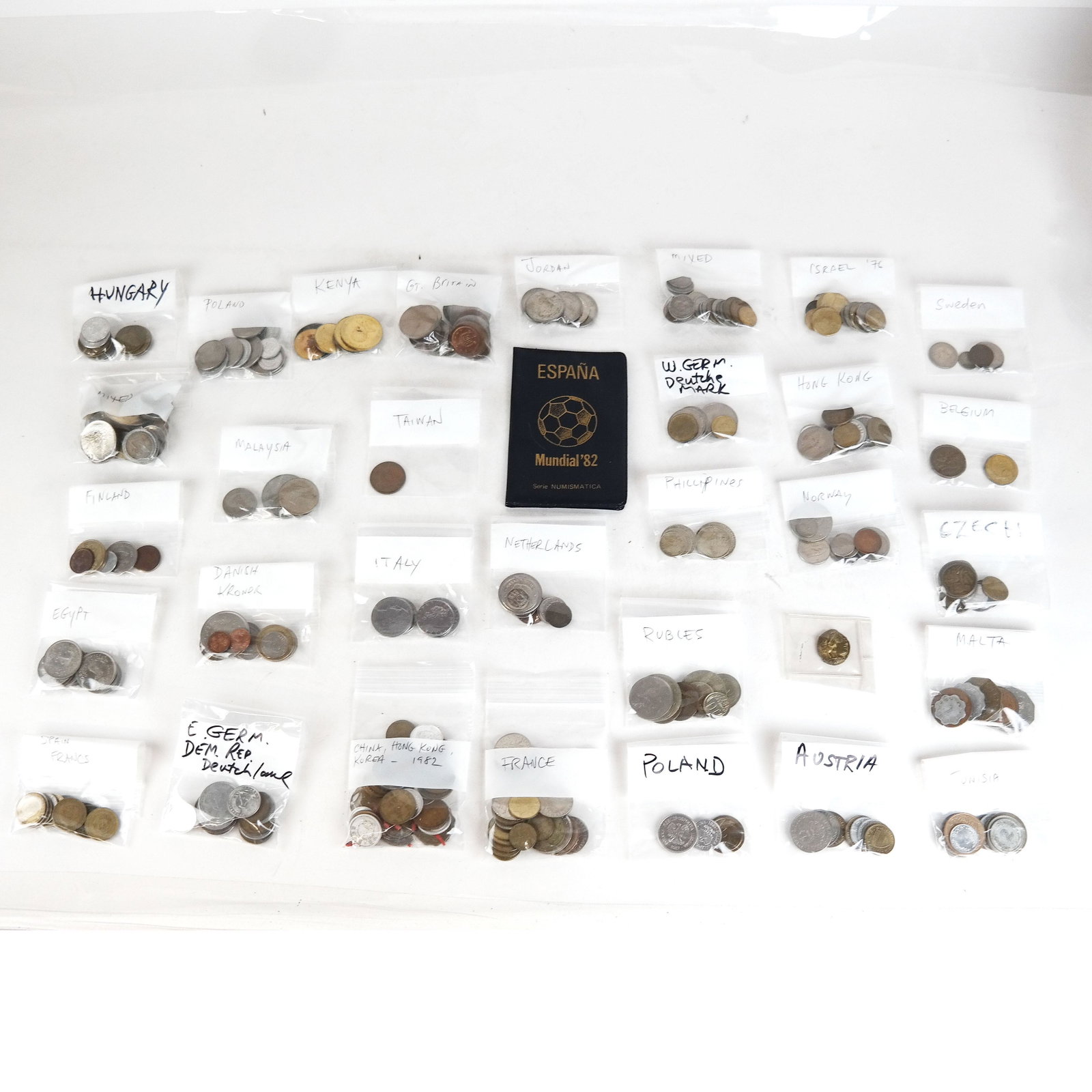 Lot of Assorted Internation Coins: Lot of assorted coins, some still in circulation, including Canadian, Chinese, International, European, Scandinavian, Tunisian, Egyptian and Asian. In various conditions.