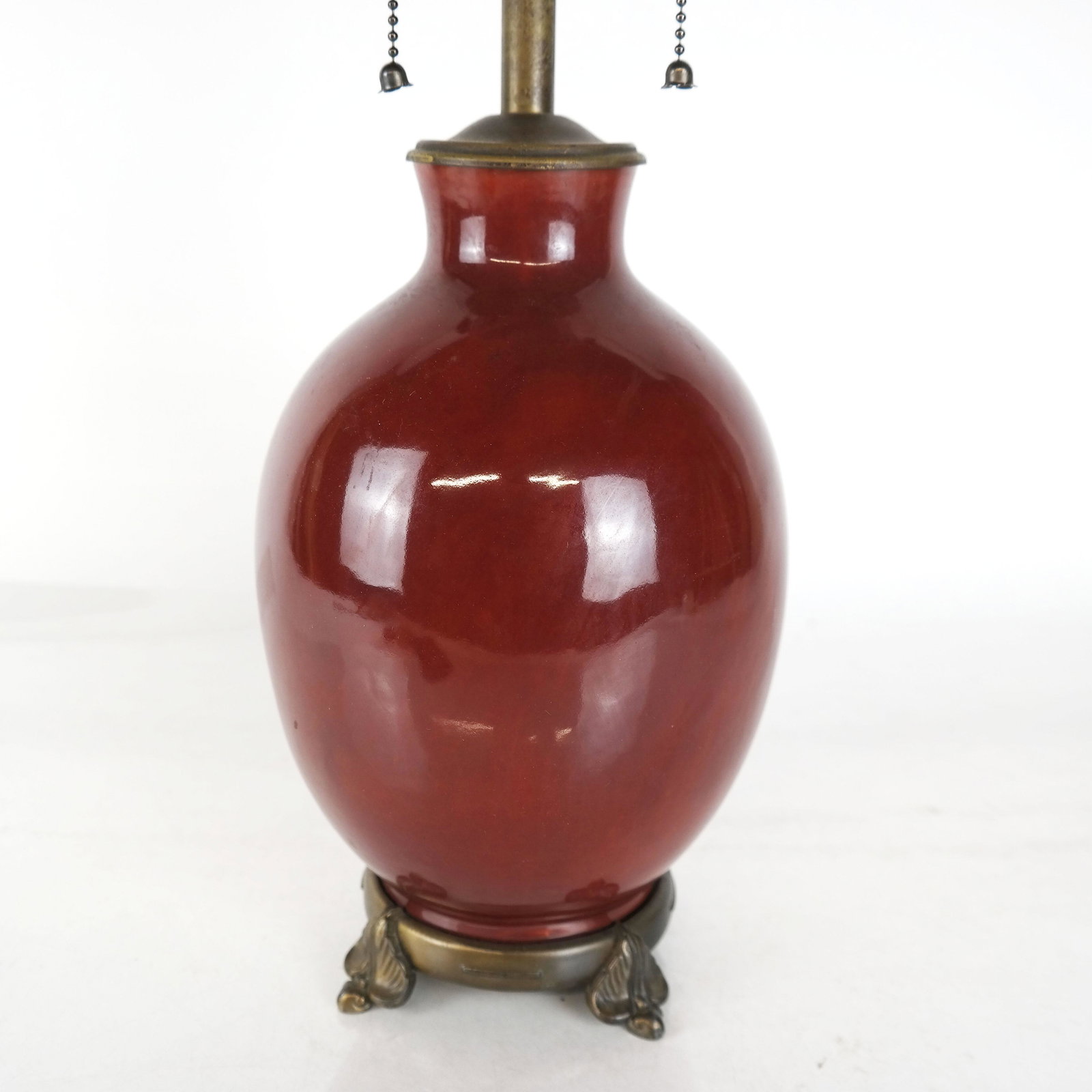 Chinese Sang de Bouf Porcelain Lamp: Chinese Sang de Bouf porcelain lamp. [Total: 23" H]. In good condition.
