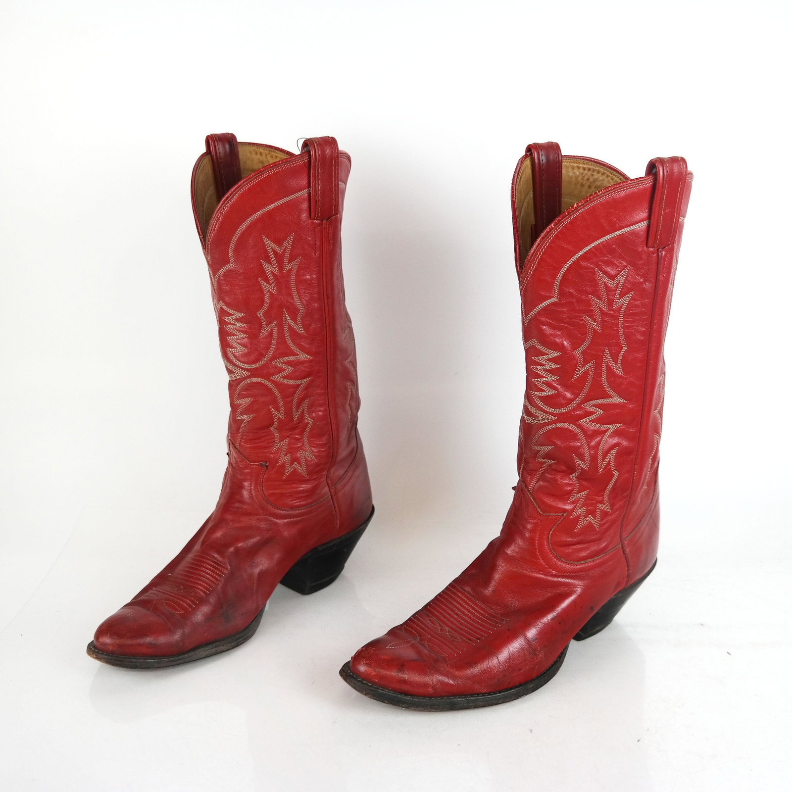 Pair of Custom Red Leather Cowboy Boots: Pair of custom made red tooled leather cowboy boots, 11" L. Wear to soles; moderate wear to leather.