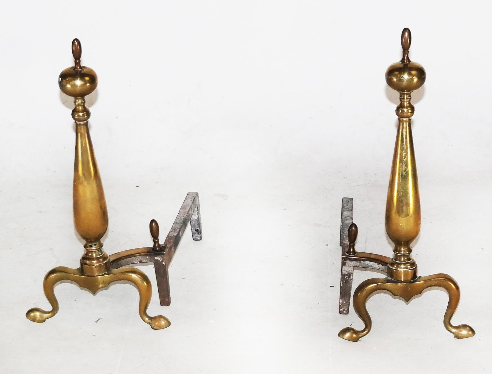 Pair of American Bronze Andirons: Pair of American bronze andirons. [18" H x 17" W x 9"].
