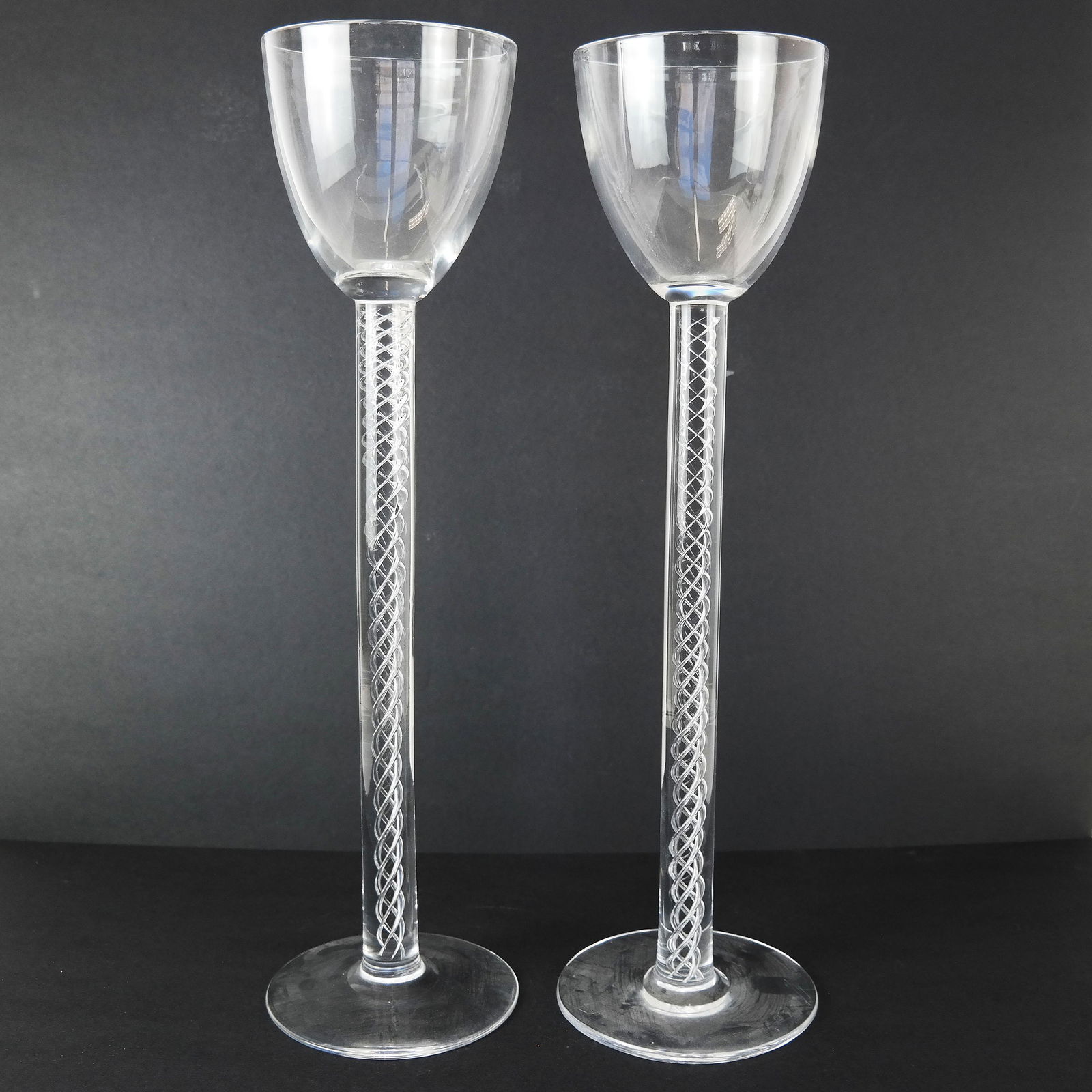 Pair Very Tall Steuben Wine Stems: Large bowl on tall interior entwined stems, on wide bases. [18" H x 5" Diam.]. In good condition.