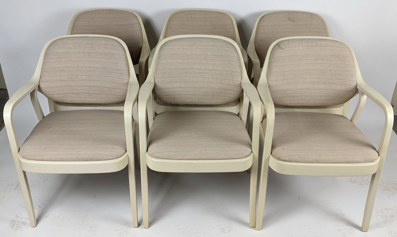 Set of 6 Knoll Open Arm Chairs: Set of 6 bentwood white lacquered open arm chairs, bearing "Knoll International, 350 Park Avenue" label on bottoms. [32" H x 22" W x 20" D]. In good condition.