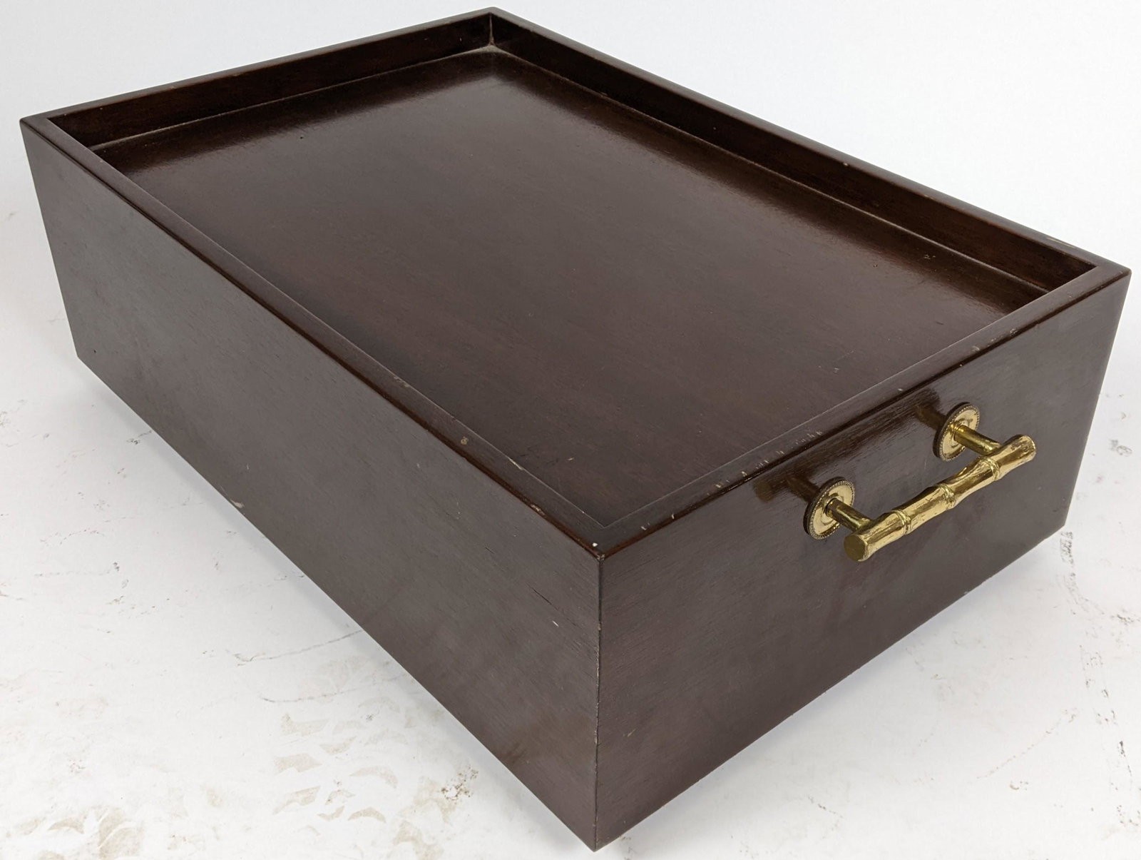Modern Mahogany Tray: Mahogany tray on wheels, with bamboo-style brass handles. [9" H x 23" W x 15" D]. In good condition.