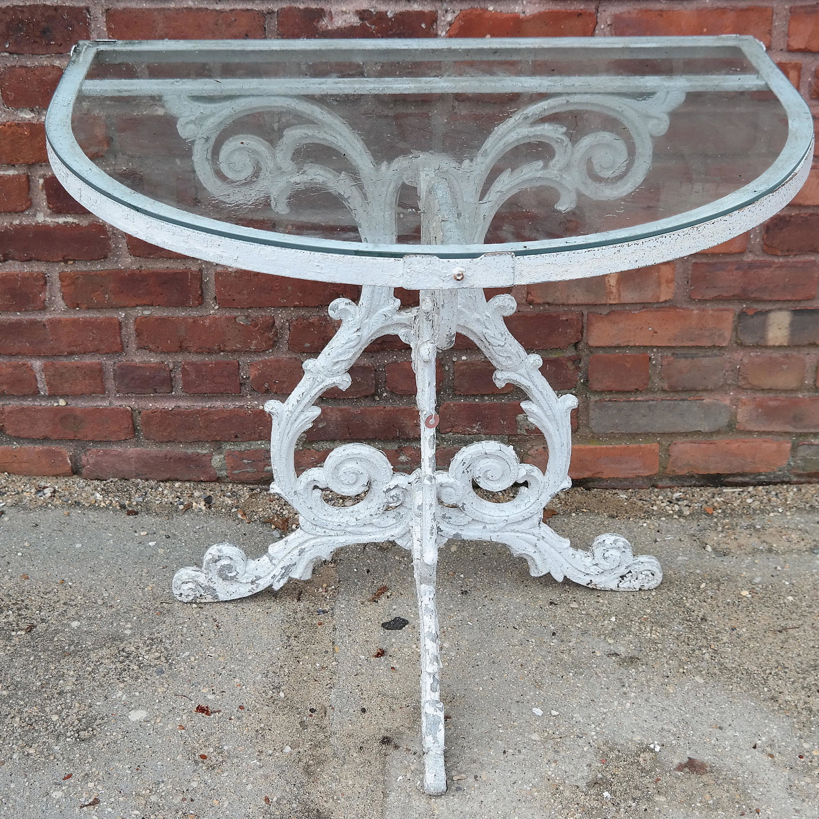 Vintage Cast Iron D-Shaped Console: Victorian style cast iron console with glass inset top. [28" H x 32" W x 24" D].