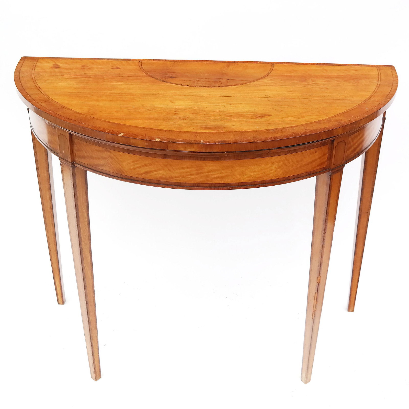 Satinwood Inlaid Console Table: Satinwood inlaid demilune console table. [33" H x 41" W x 20" D]. Splits; veneer losses; wear and chips to legs.
