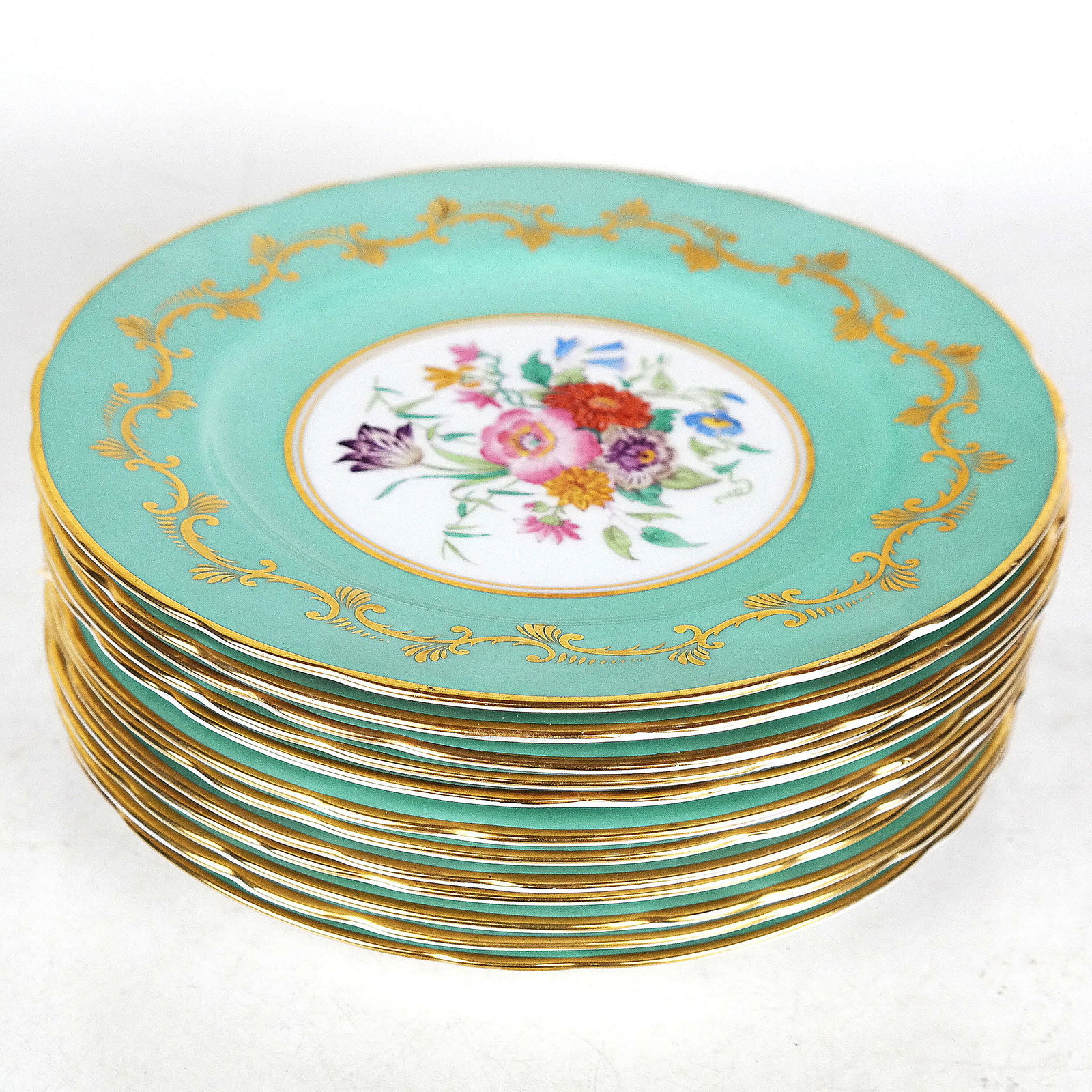 Set of 12 Copelands Grosvenor Place Plates: Twelve plates, decorated with a floral center on light blue ground. [9" Diam.]. In good condition; no chips.