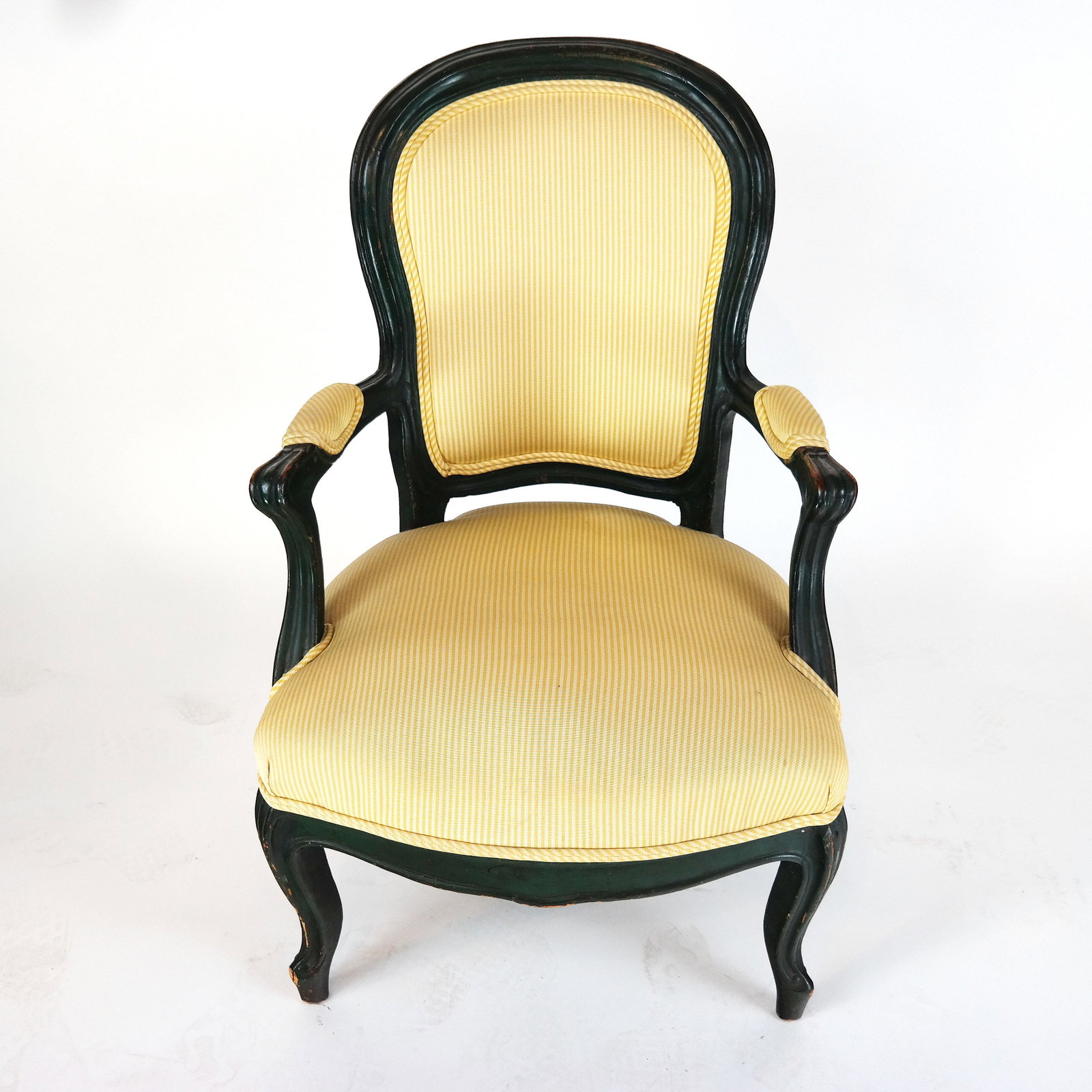 Victorian Arm Chair: Victorian arm chair, painted black, with gold upholstered seat and arm rests. [35" H x 22 1/2" W x 18" D]. Upholstery in good condition; wear to wood.