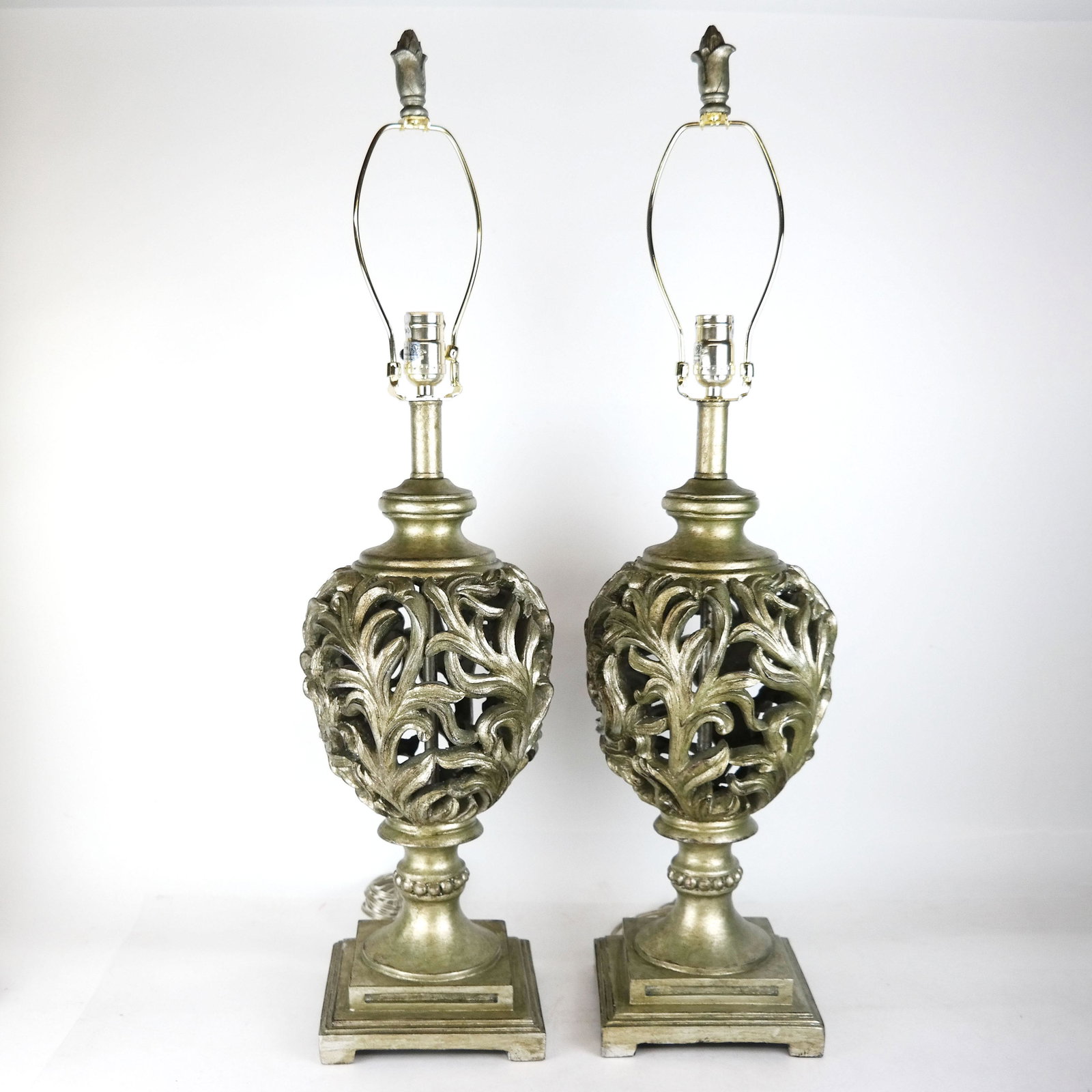 Pair of Open Vase Form Lamps: Pair of open vase form lamps with green tint silvered resin. [34" H x 8" Diam.].